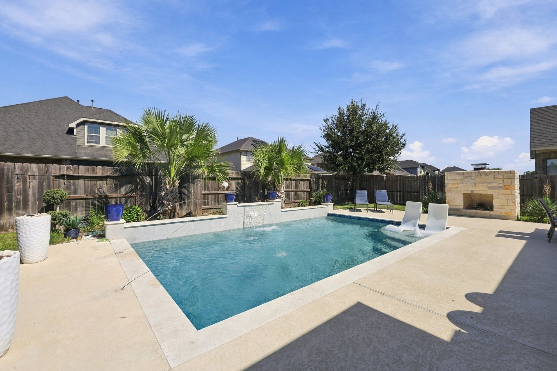 Just beyond the patio, a sparkling heated swimming pool welcome you into your own backyard retreat.