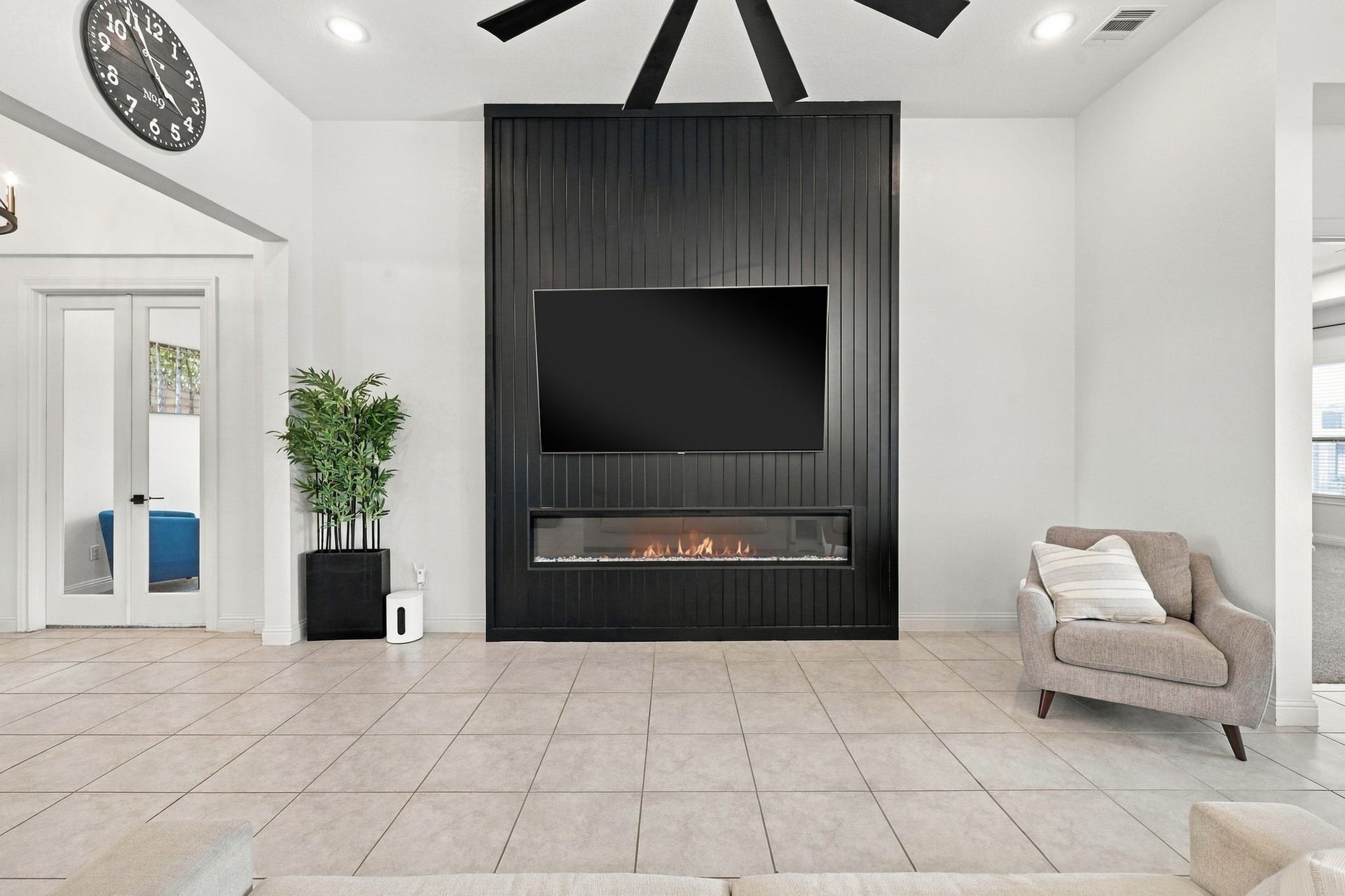 Take a closer look at the stunning floor-to-ceiling fireplace feature, a beautiful upgrade that anchors the living room.