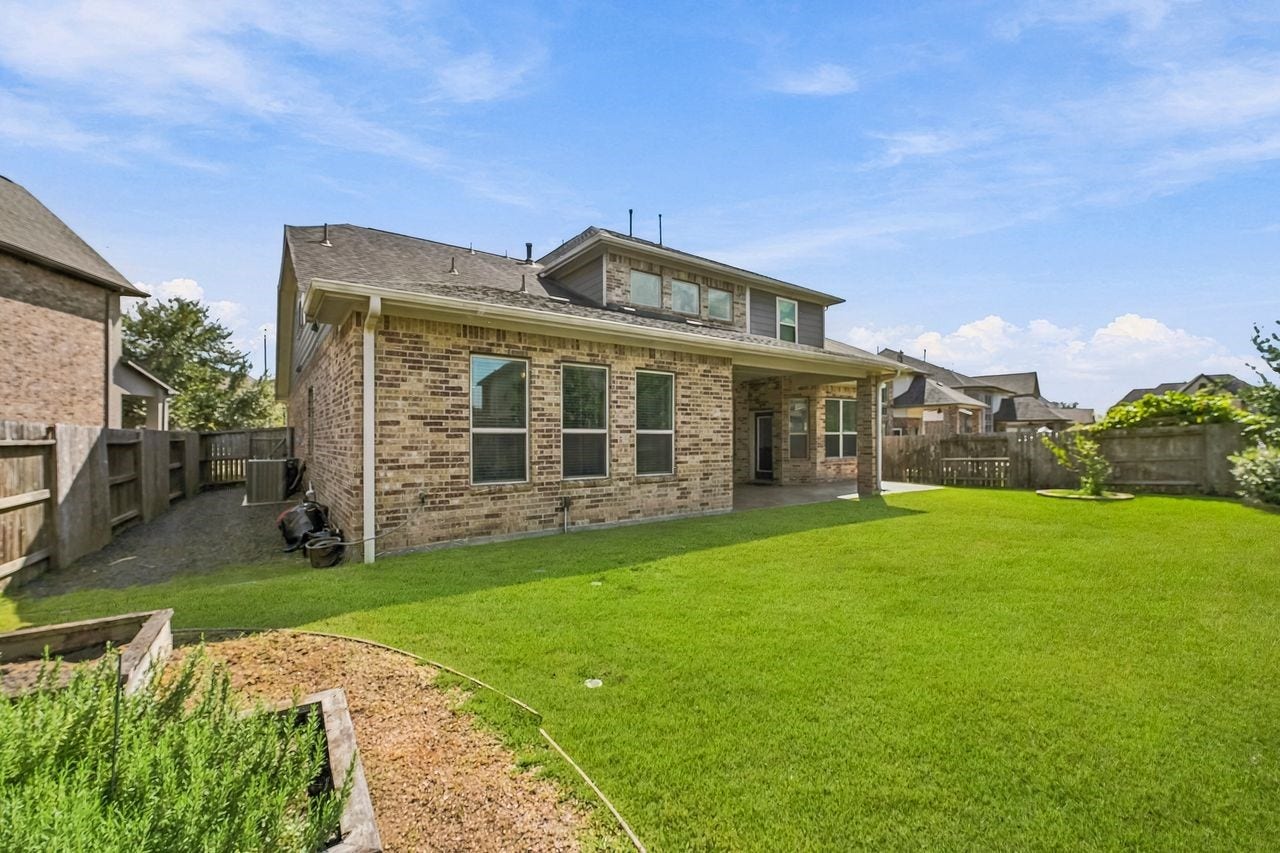 2215 Hermina Radler Drive, Richmond, TX 77469 Thoughtfully engineered French drains ensure optimal site drainage and a pristine backyard year-round.