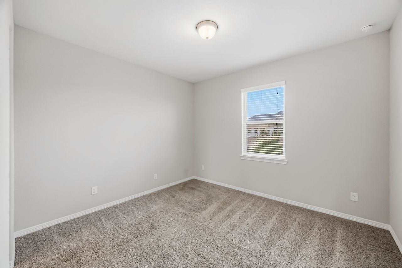 2215 Hermina Radler Drive, Richmond, TX 77469 One of two secondary bedrooms featuring a shared en suite bathroom.