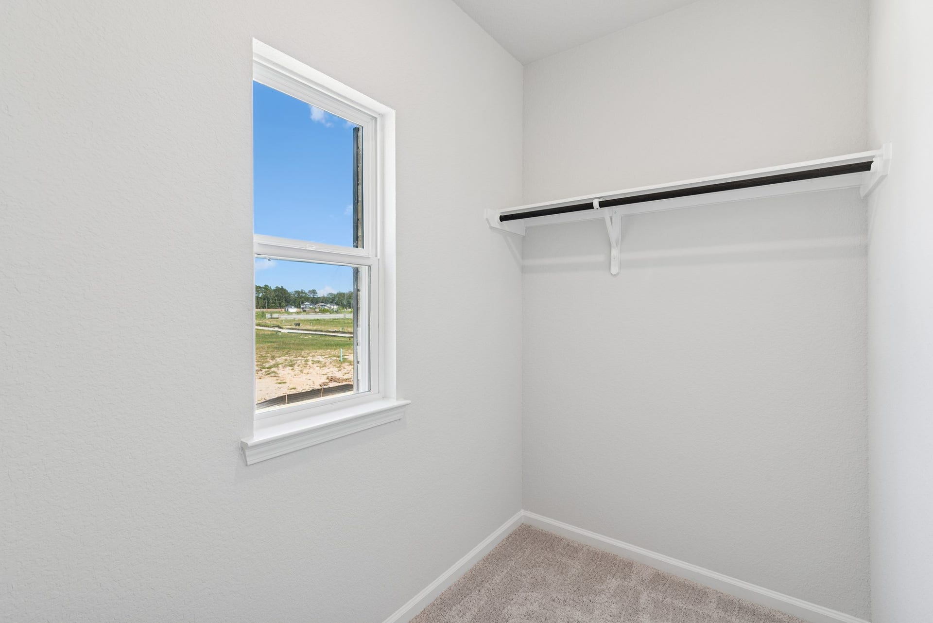 19130 Malatya Court, Montgomery, TX 77316 The Oriole II- Primary Bedroom Walk-in Closet 2. Sample image to be used for example only, colors, options and upgrades vary.