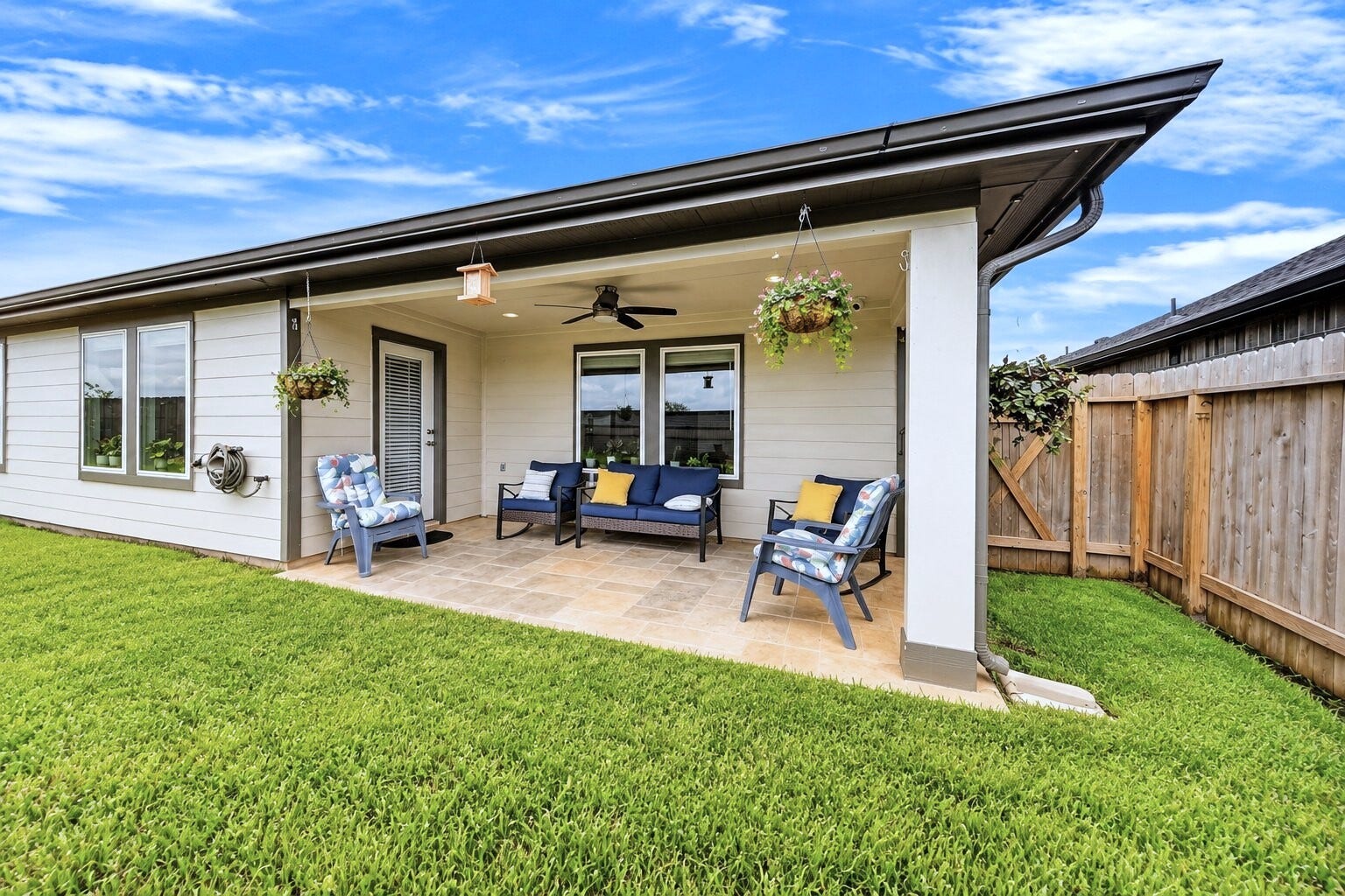 31207 Kenswick Grove Lane, Fulshear, TX 77441 A backyard patio creates a spot to enjoy your morning coffee or unwind outdoors.