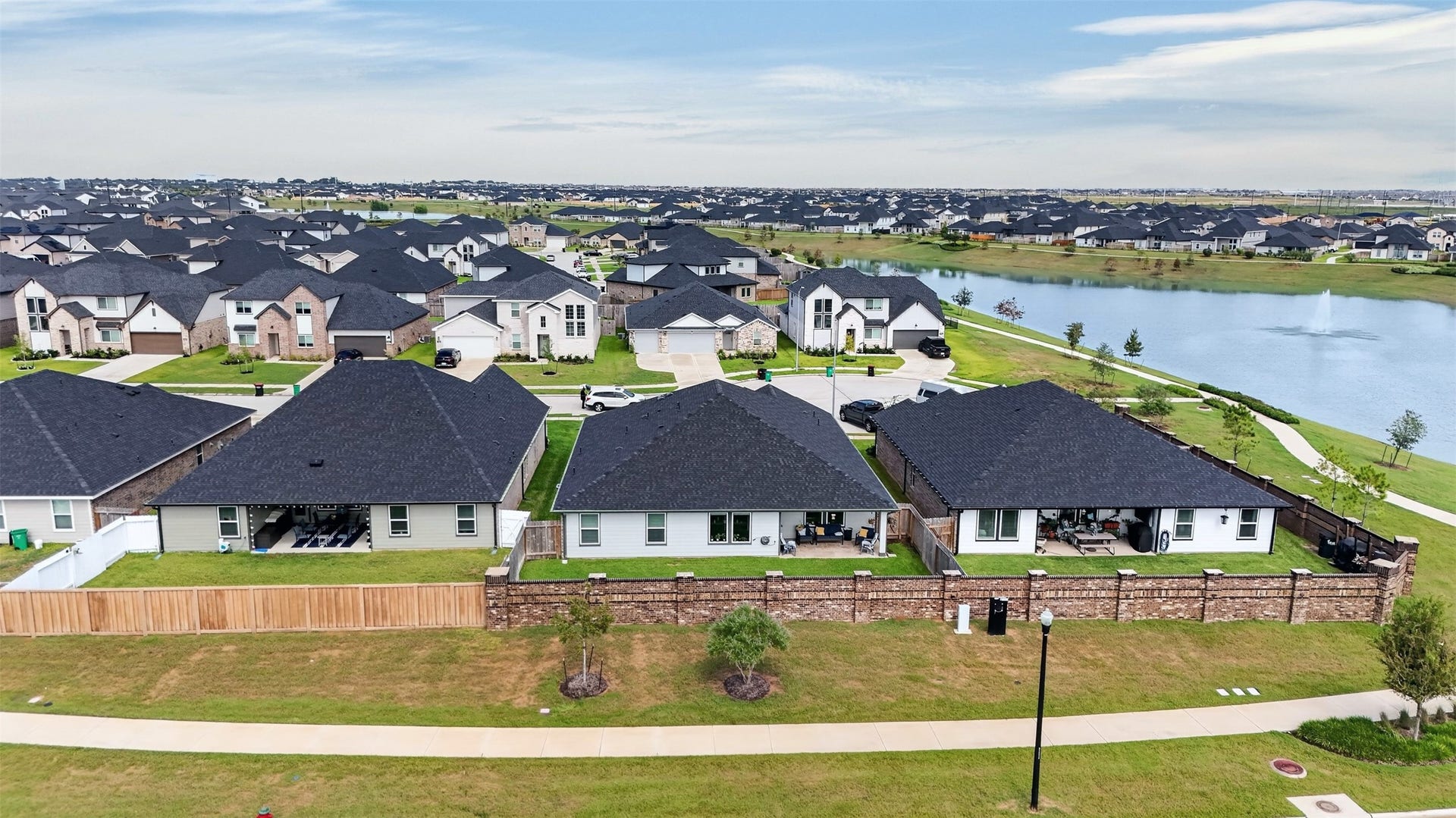 31207 Kenswick Grove Lane, Fulshear, TX 77441 Enjoy a scenic view of the community and nearby walking trail, adding a pleasant outdoor setting to the surrounding neighborhood.