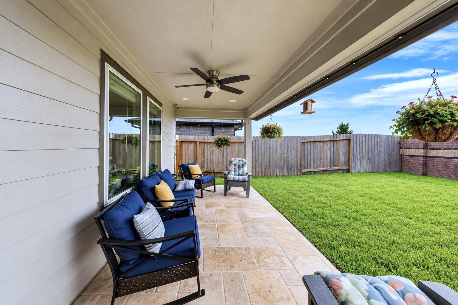 31207 Kenswick Grove Lane, Fulshear, TX 77441 A backyard patio creates a spot to enjoy your morning coffee or unwind outdoors.