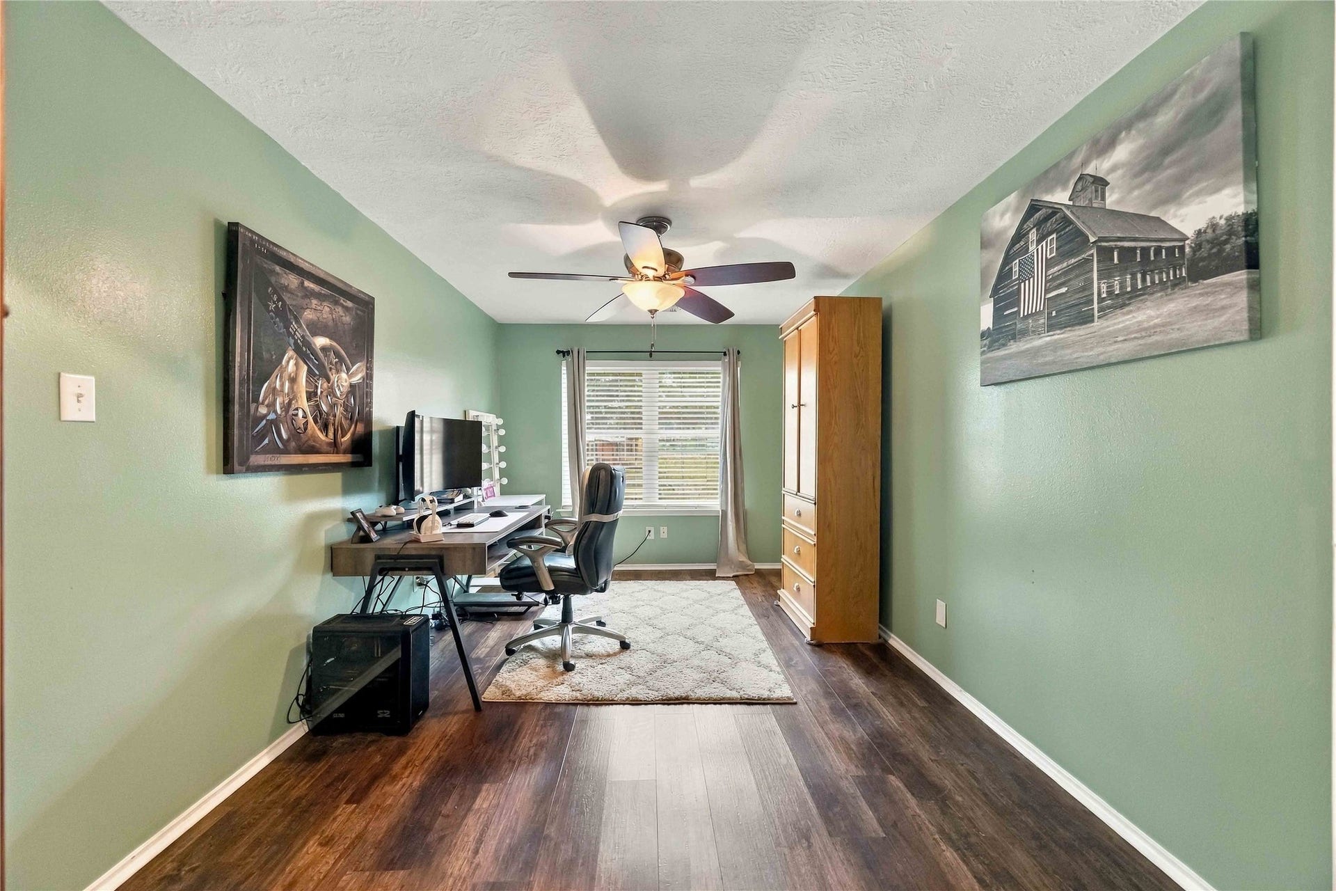 Generously sized secondary bedroom offers an elongated layout, natural light, and flexibility for sleeping, office, or study use.