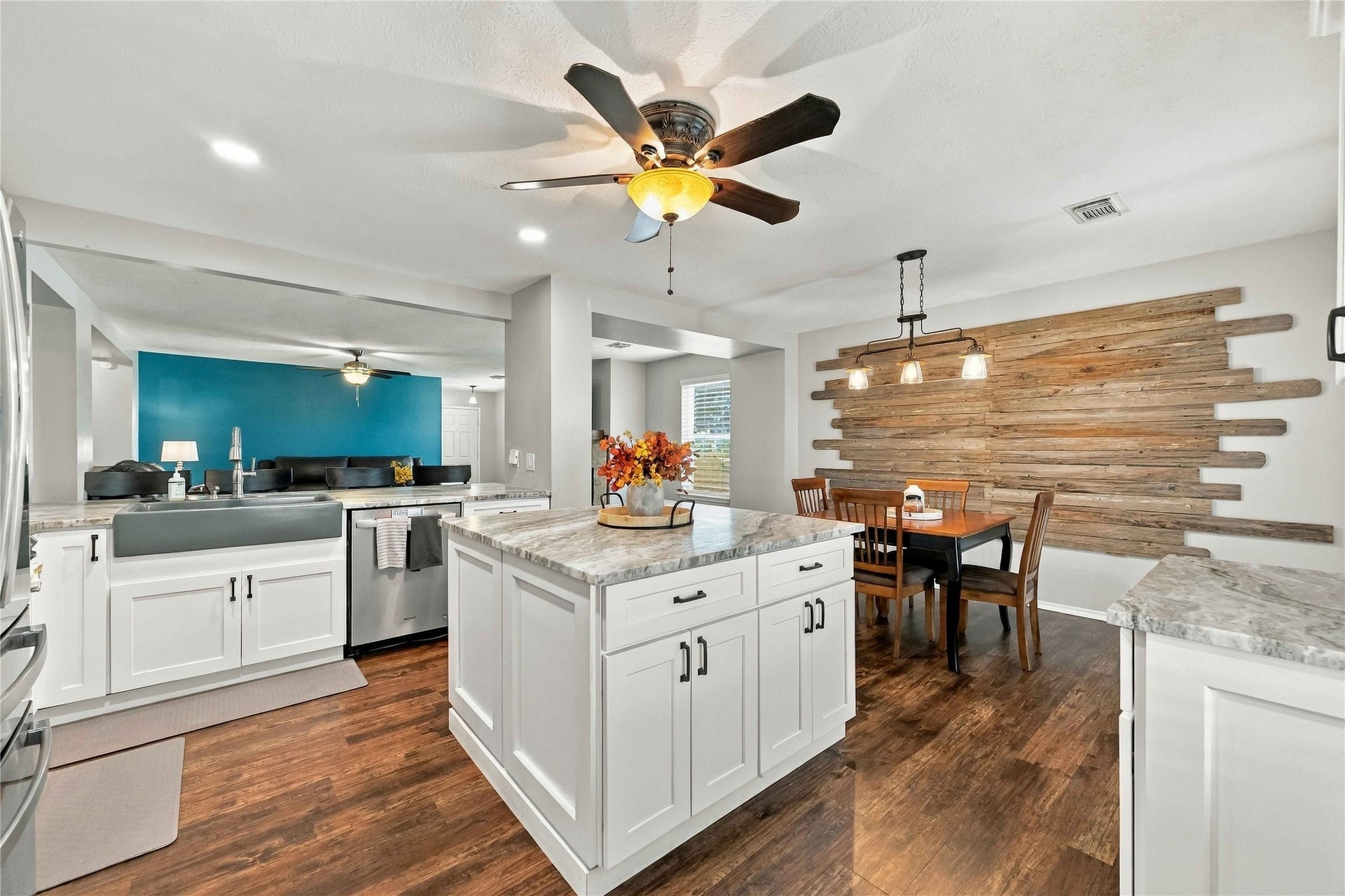 Spacious kitchen centers around an oversized island with abundant storage and flows naturally into the dining and living areas.