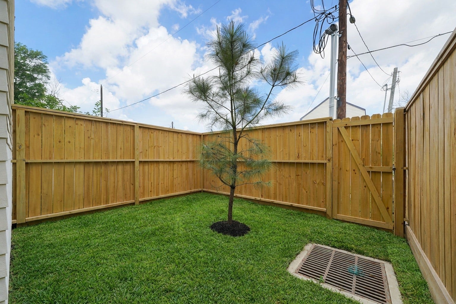 Discover a charming, fenced backyard that offers cozy privacy with minimal upkeepperfect for effortless outdoor enjoyment.