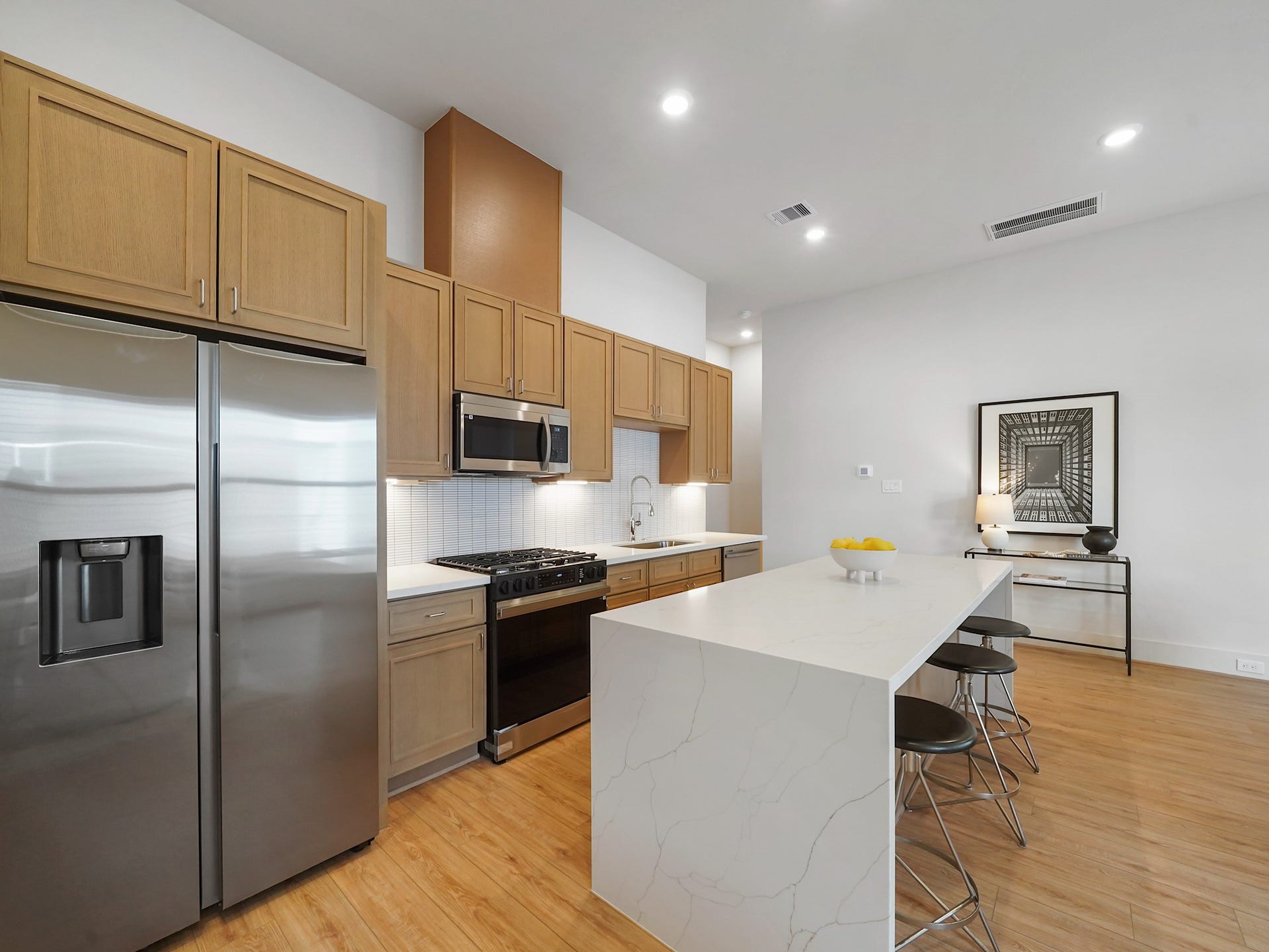 This stunning space boasts high ceilings and seamless transitions, offering an open, airy feel perfect for modern living.