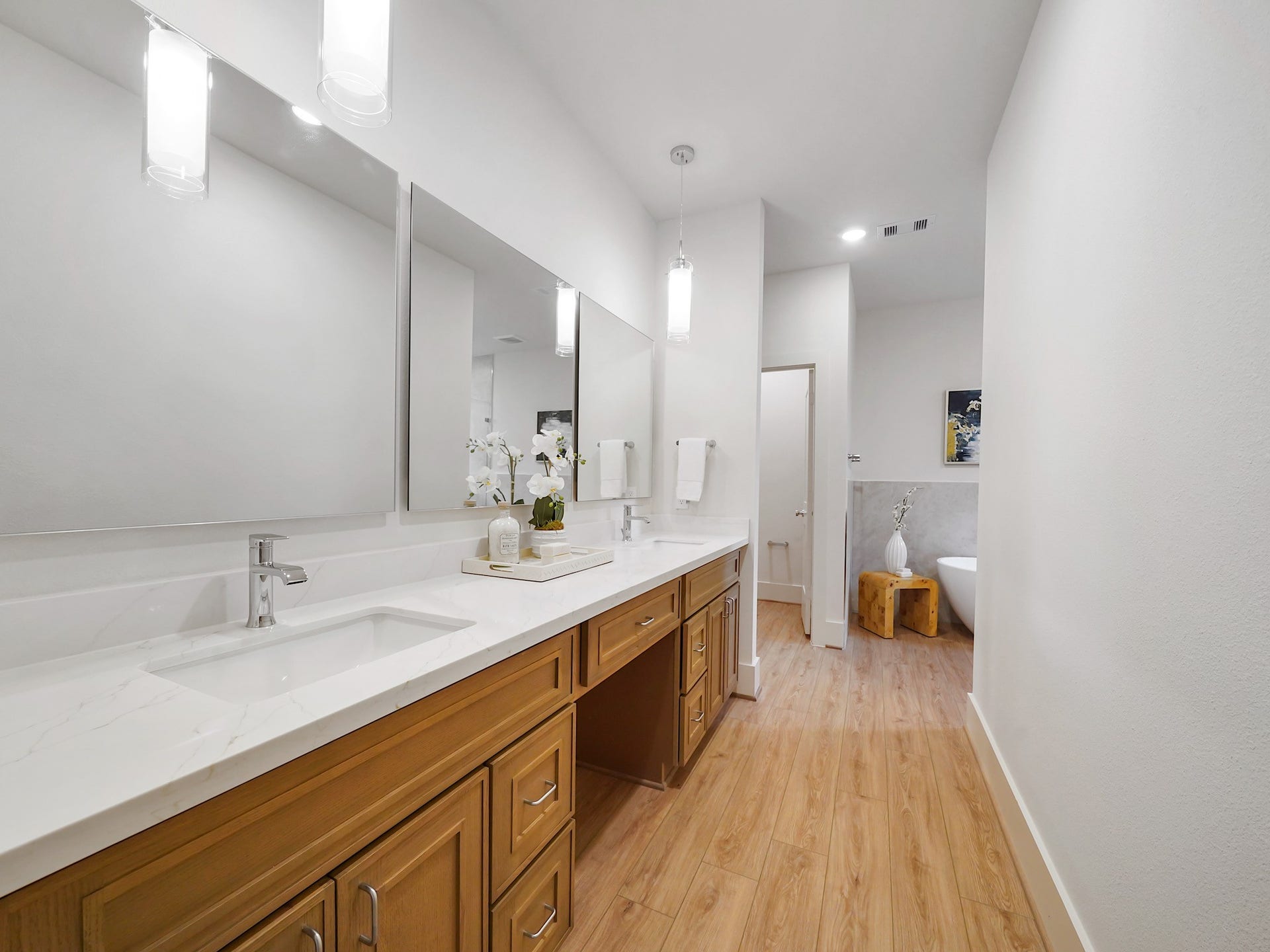 Experience the luxury of convenience in the primary bath with elegant double sinks and a spacious vanity.