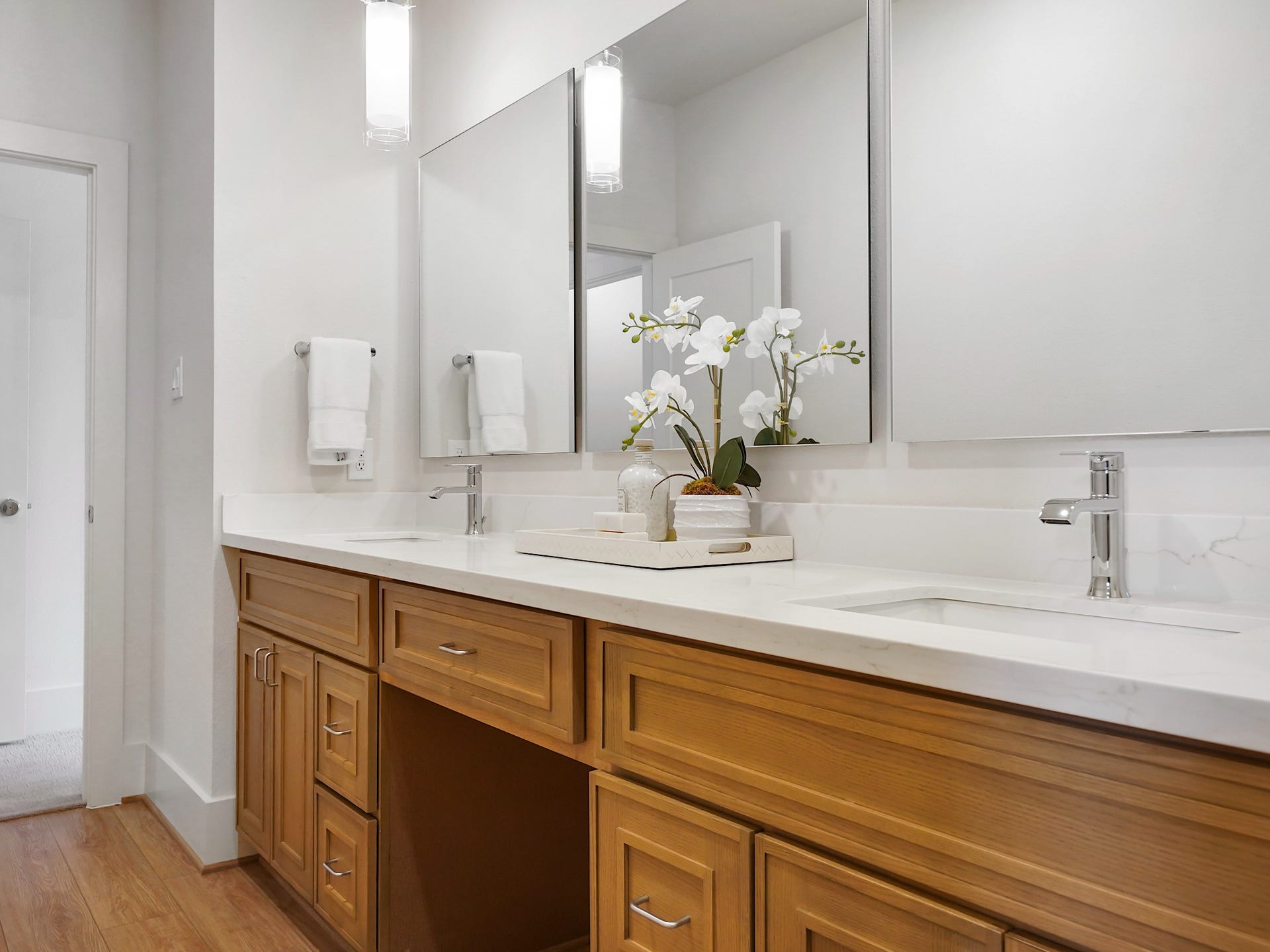 This primary bath combines elegance and practicality with its double sinks and spacious vanity, ensuring both convenience and style.