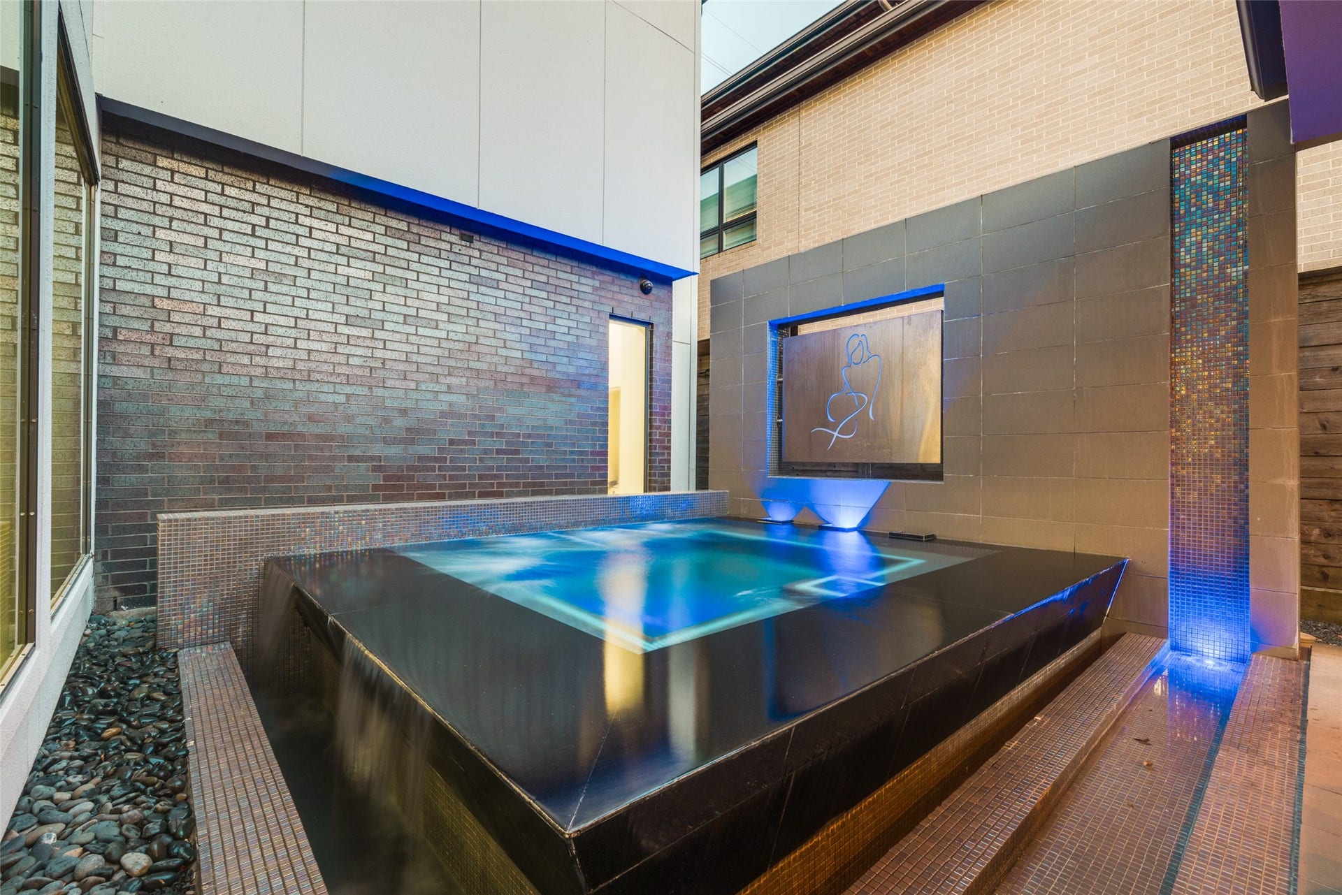 2014 Park Street, Houston, TX 77019 Luxurious custom cocktail heated, salt water pool with LED Multi color lights & waterfall edges - recipient of the 2015 PRISM Award for Best Patio