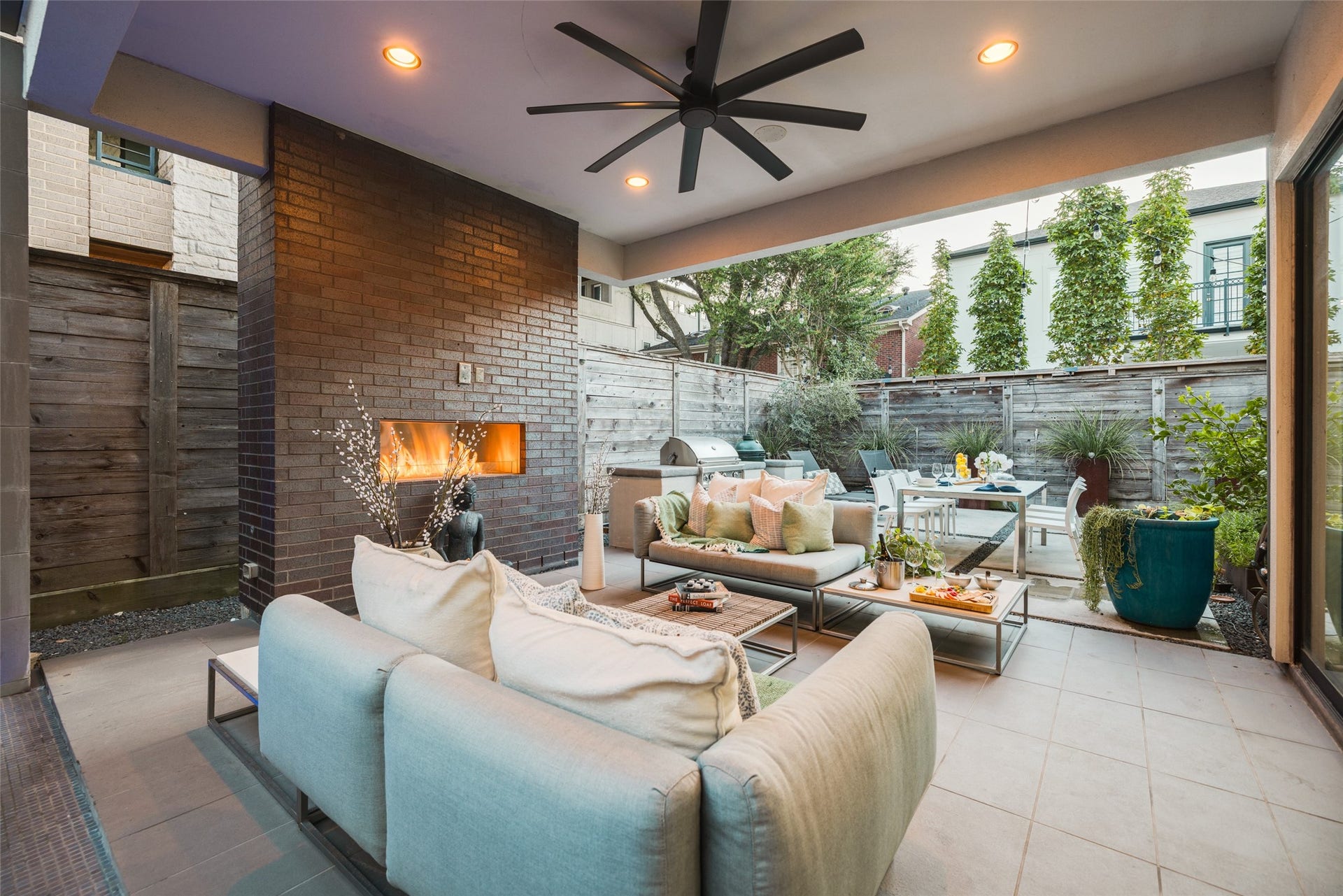 2014 Park Street, Houston, TX 77019 Experience the ultimate outdoor entertainment with floor-to-ceiling sliding glass doors that effortlessly open to the covered outdoor patio and backyard which is encased by an 8 foot cedar fence providing privacy