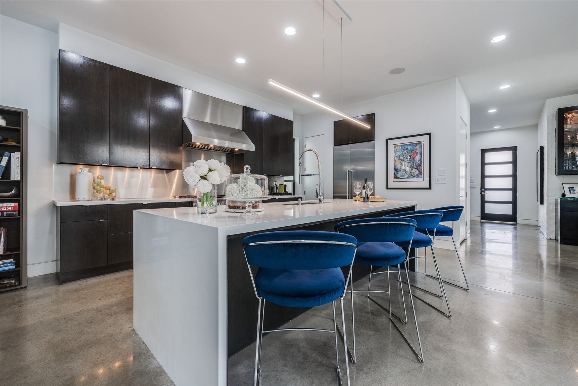 2014 Park Street, Houston, TX 77019 Large Thermador SS refrigerator, large walk in pantry & extra storage from the elevator shaft cupboards, beautiful designer pendant lighting, large island with quartz waterfall edge, 10 ft ceiling.