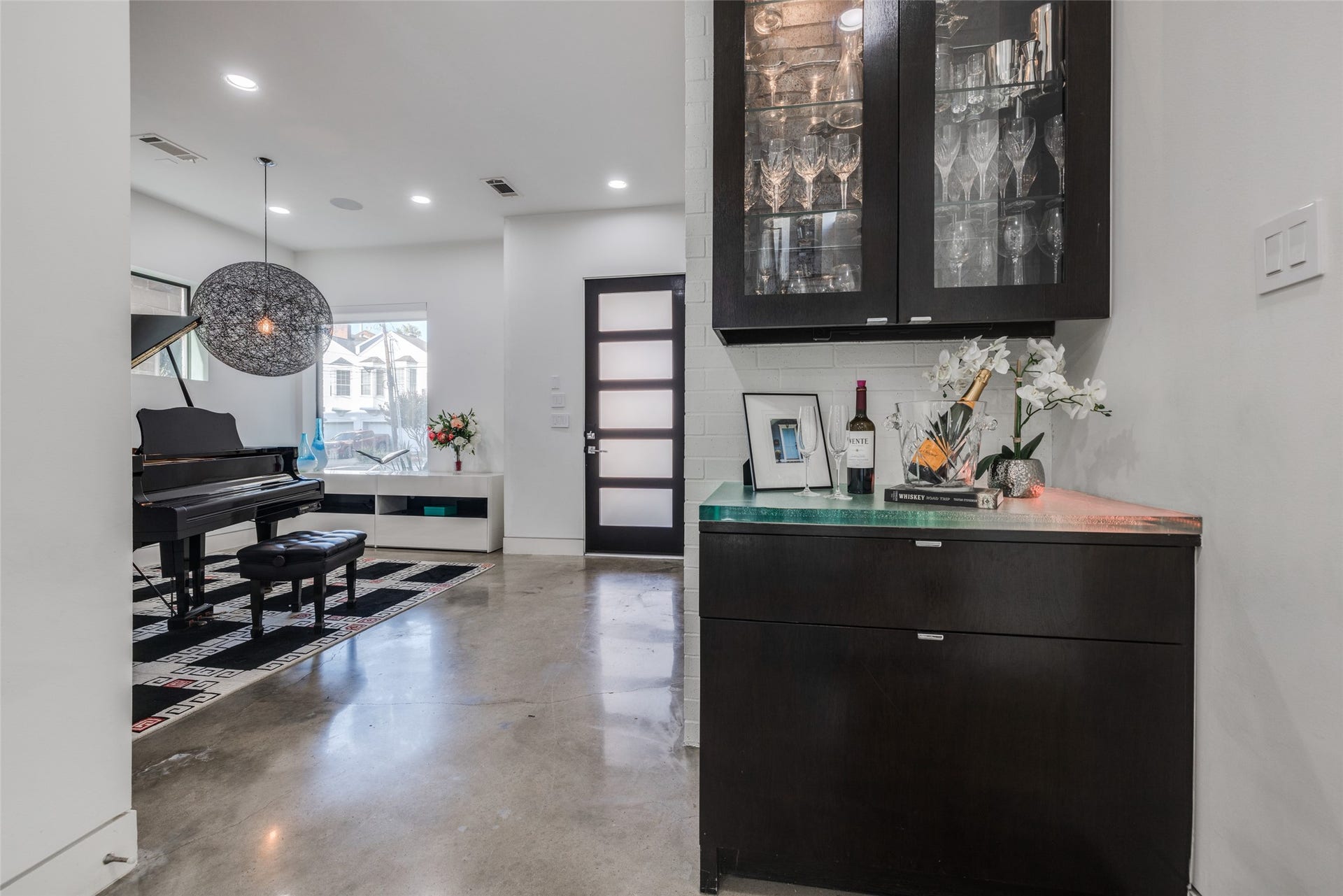 2014 Park Street, Houston, TX 77019 Have lots of fun entertaining with the walk up LED backlight acrylic counter top, glass front cabinets with lighting & soft close doors, brick recently painted white.