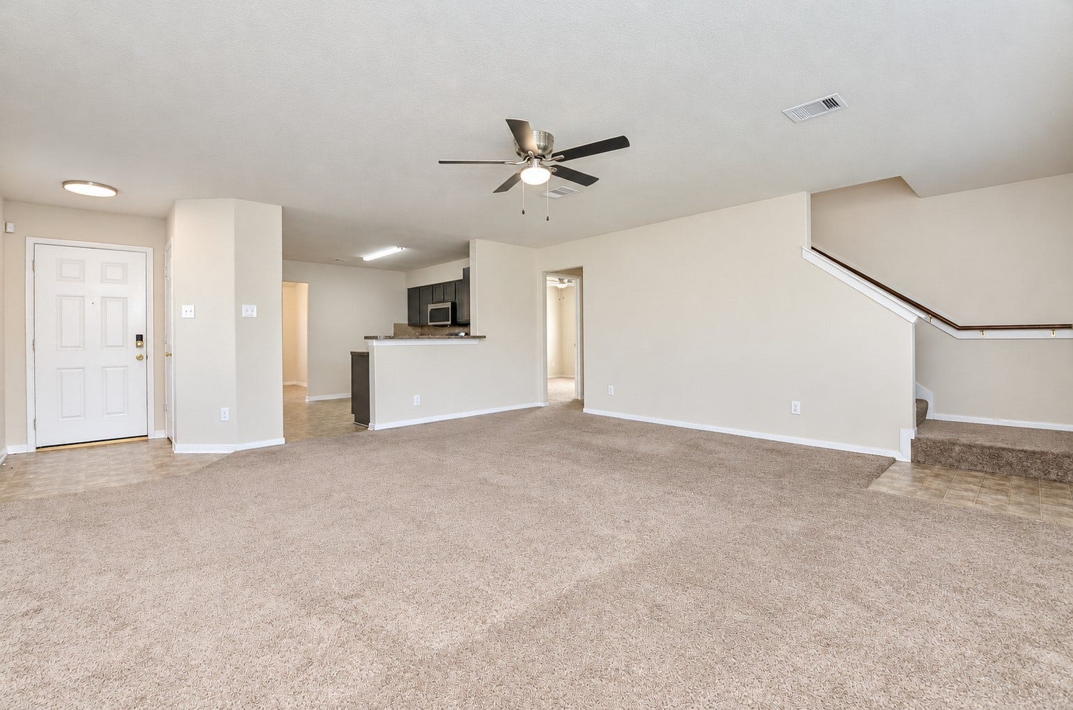 5031 Grove Square Court, Katy, TX 77449 Open-concept family room with convenient access to the kitchen, staircase and additional living spaces.