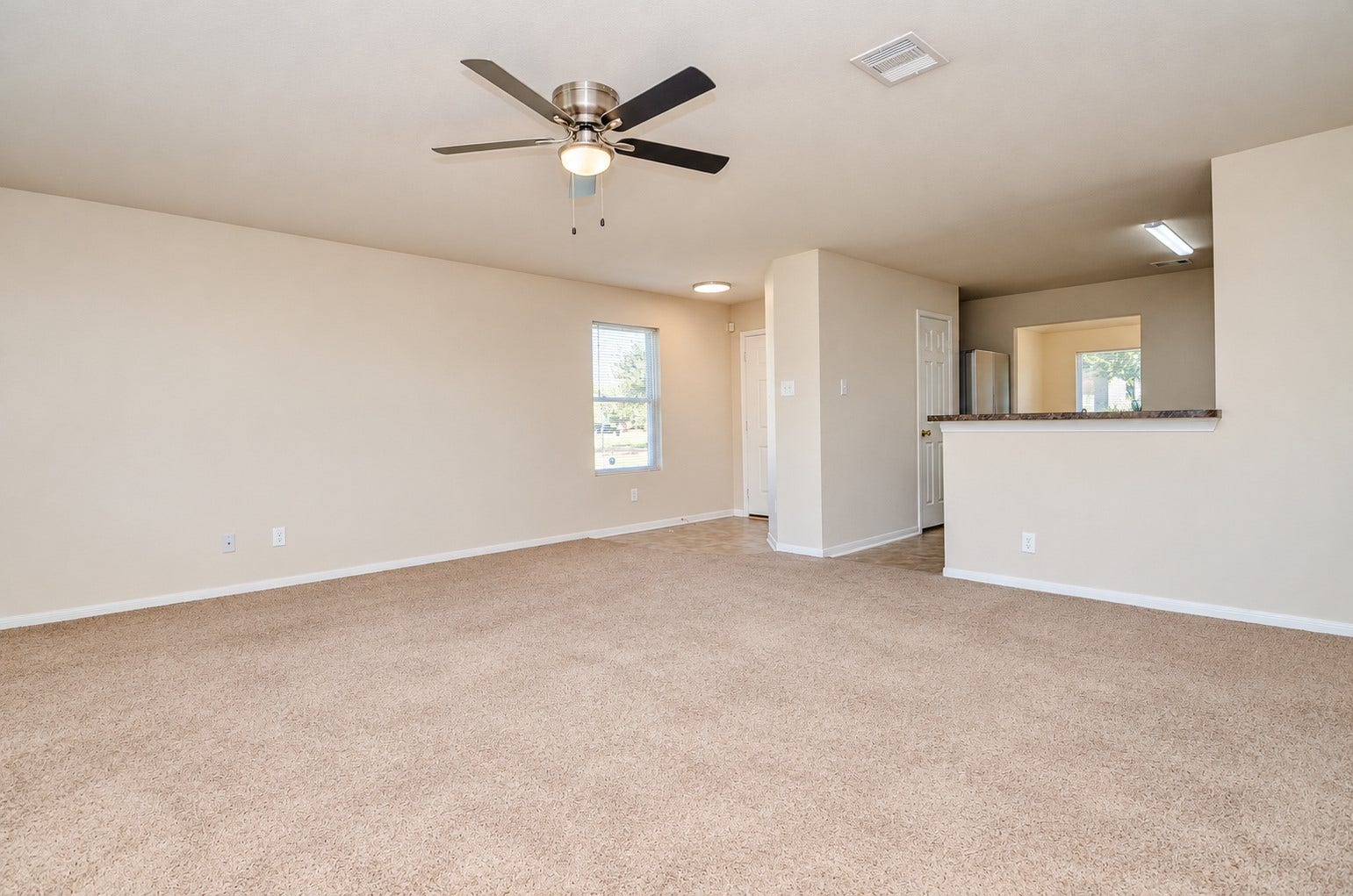 5031 Grove Square Court, Katy, TX 77449 Additional view of the spacious family room, highlighting the open layout and convenient access to the kitchen and dining areas.