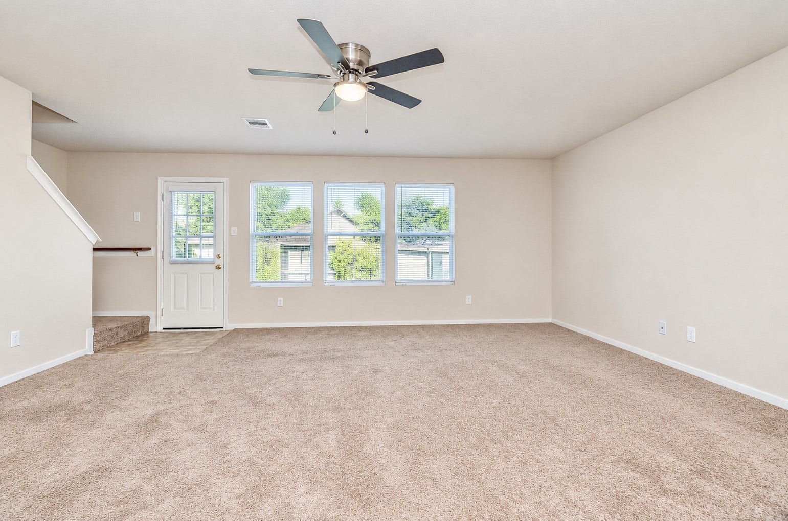 5031 Grove Square Court, Katy, TX 77449 Expansive family room with large windows overlooking the backyard and plenty of space for relaxing or entertaining.
