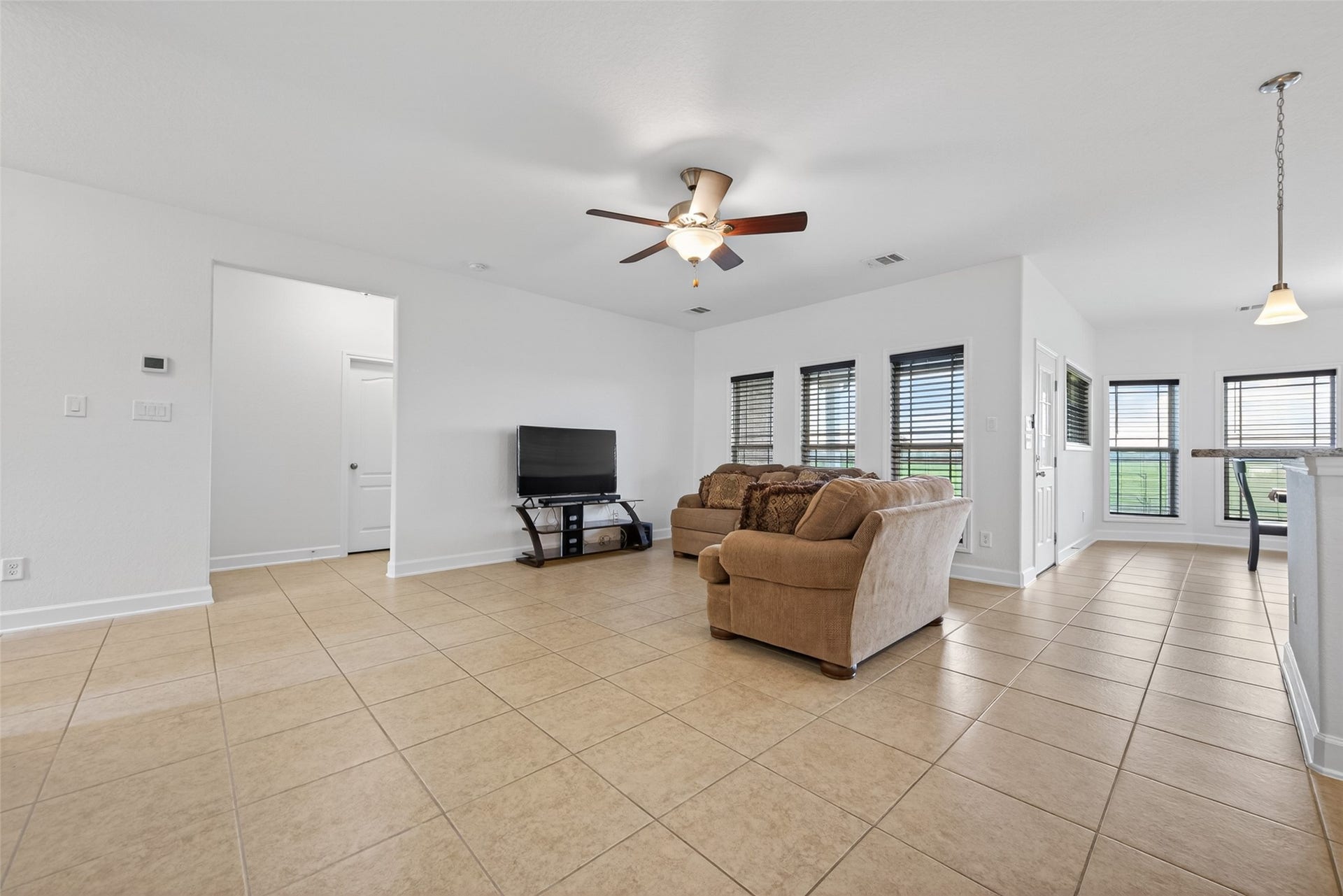 Living Room that is open to the kitchen and dining areas