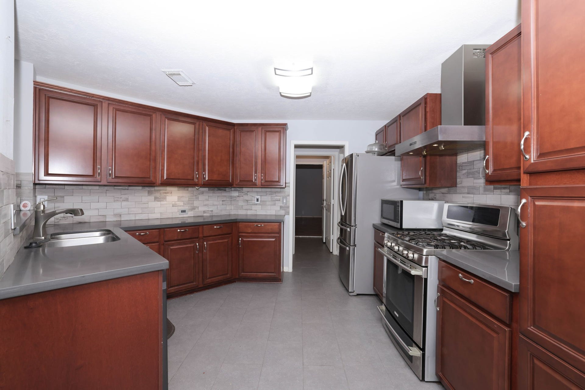 10403 Twin Oak Drive, Conroe, TX 77385 Kitchen features lots of cabinets and counters for meal prep and entertaining!