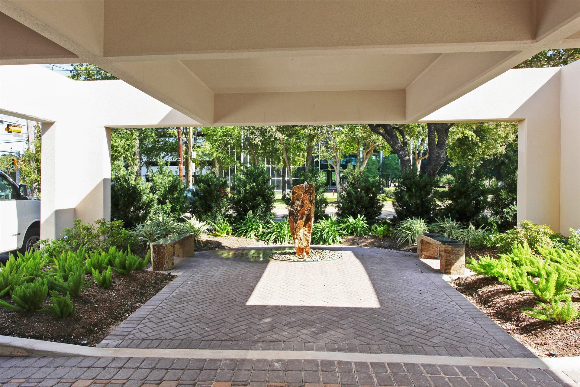 Front building entry water feature brings a sense of style adding elegance and sophistication