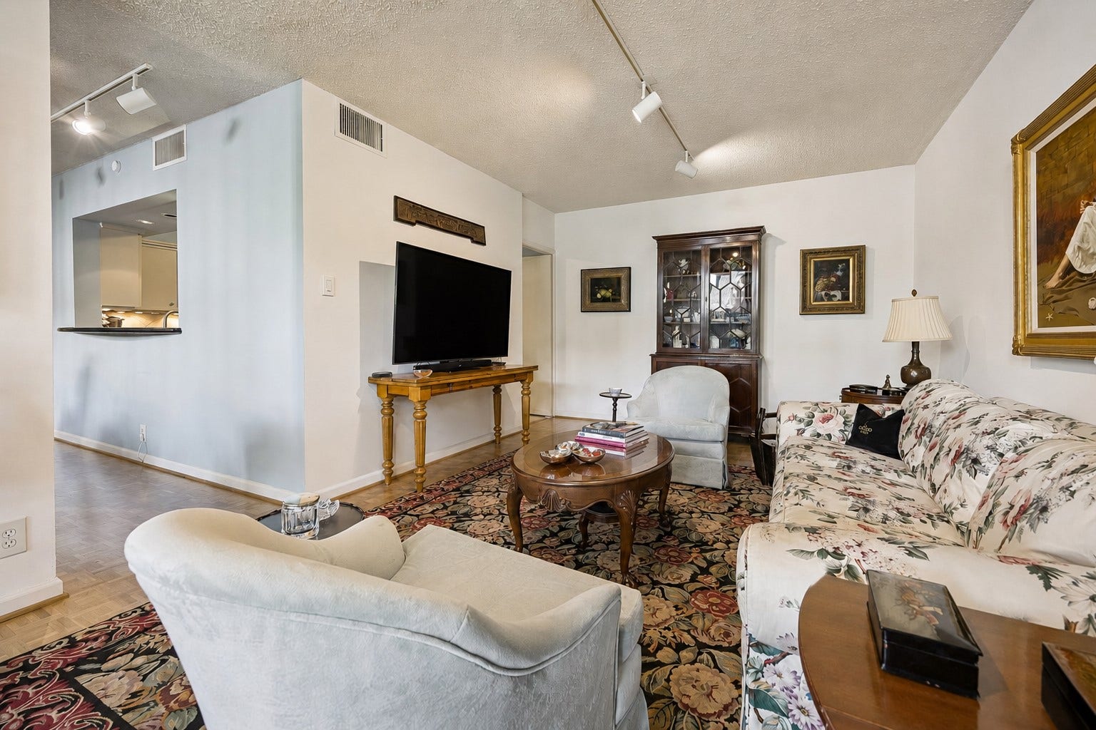 An alternate perspective highlighting the open layout connecting the living, kitchen and dining spaces