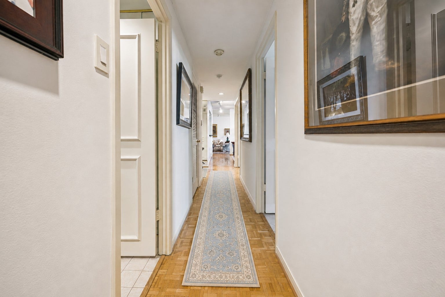Center hallway leads into the bedrooms area.