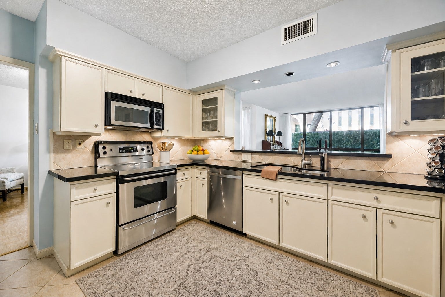 A fully equipped kitchen with efficient work flow.  A servery window keeps you connectd to your guests while prepping food