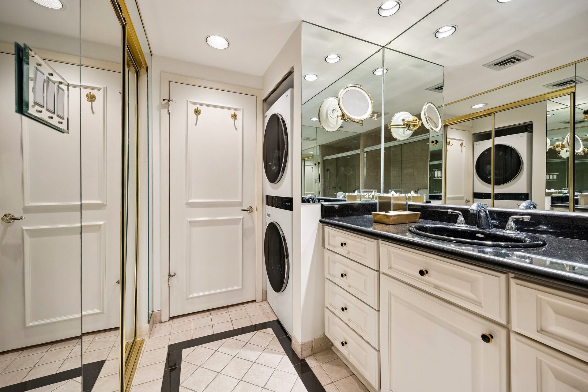 Recent addition of stackable washer and dryer thoughtfully tucked in the secondary bathroom focusing on convenience and smart use of space.