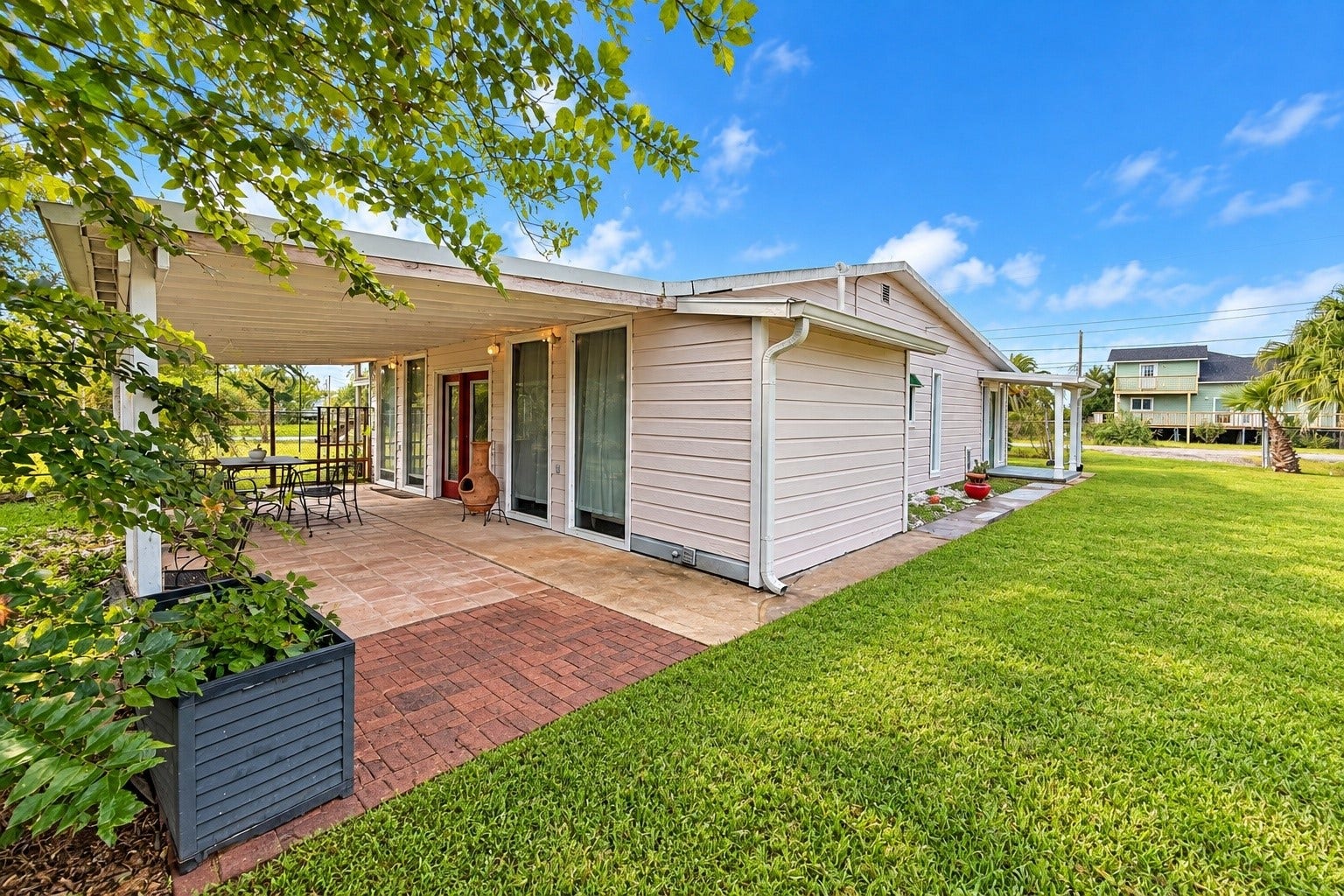 713 6th Street, San Leon, TX 77539 Large outdoor patio just off the Primary Bedroom located at the back of the house.