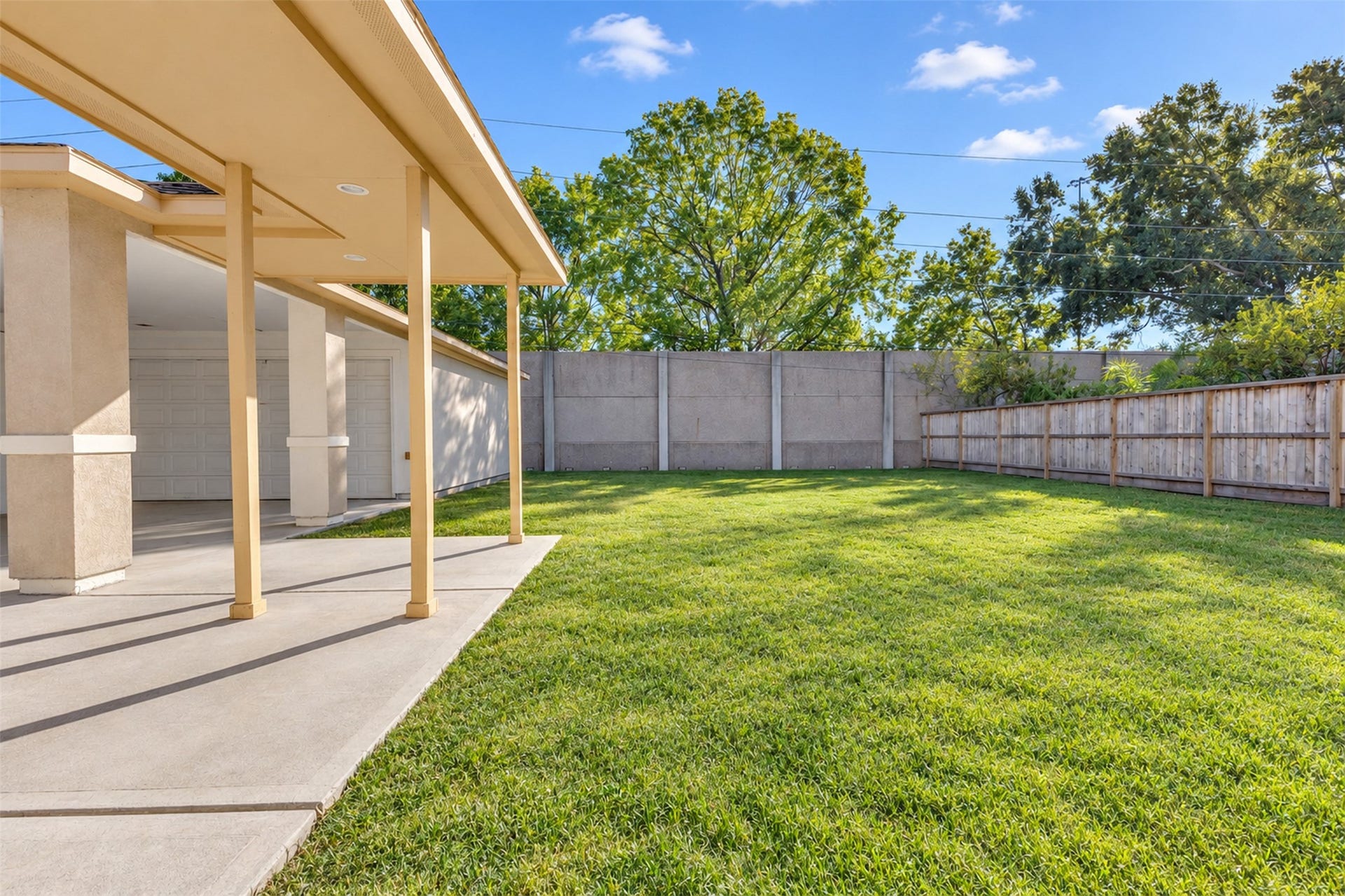 8606 Argentina Street, Houston, TX 77040 Backyard: A generously sized backyard offers space for outdoor seating, gardening, and entertaining.