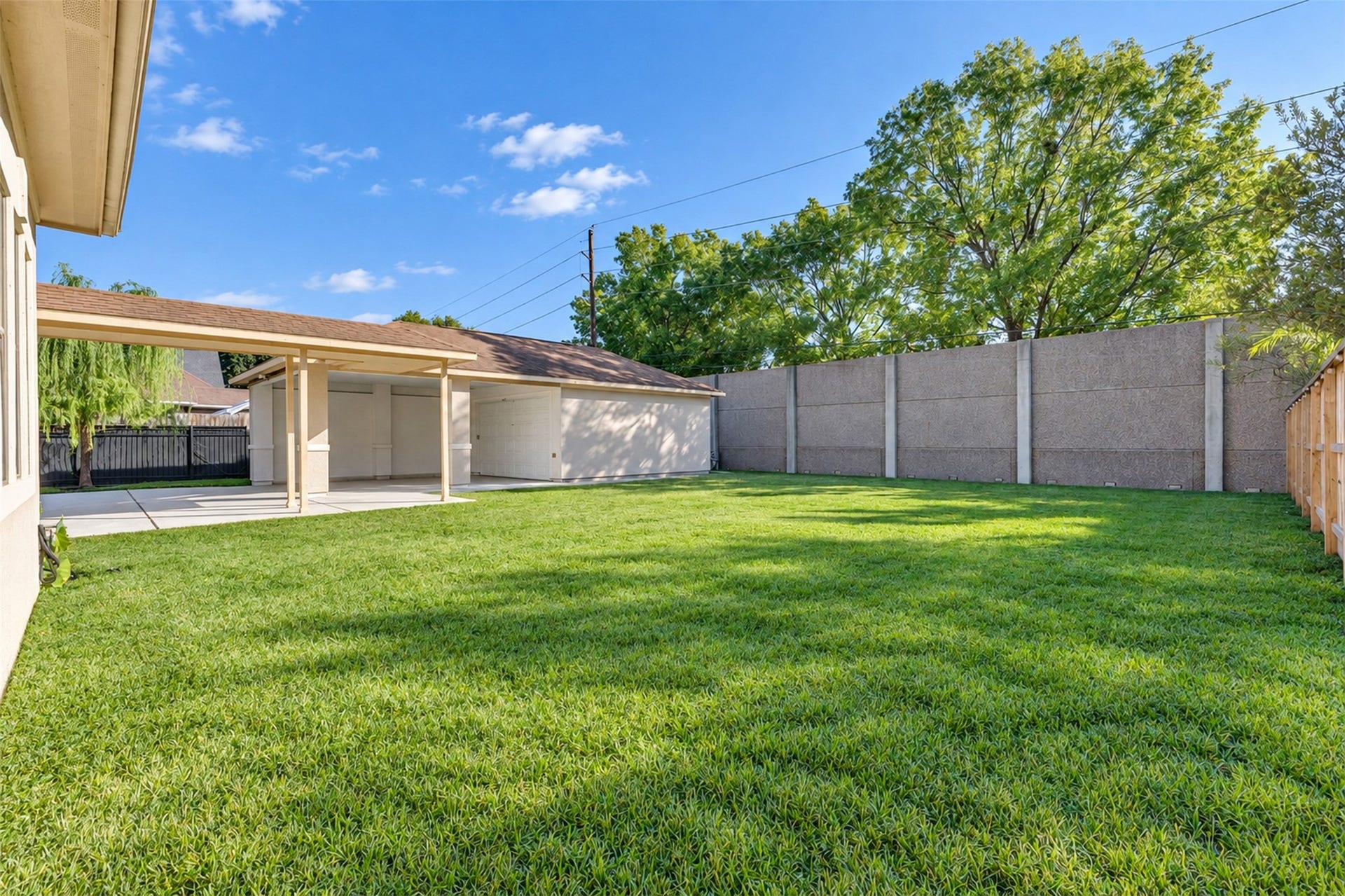 8606 Argentina Street, Houston, TX 77040 Backyard: A generously sized backyard offers space for outdoor seating, gardening, and entertaining.