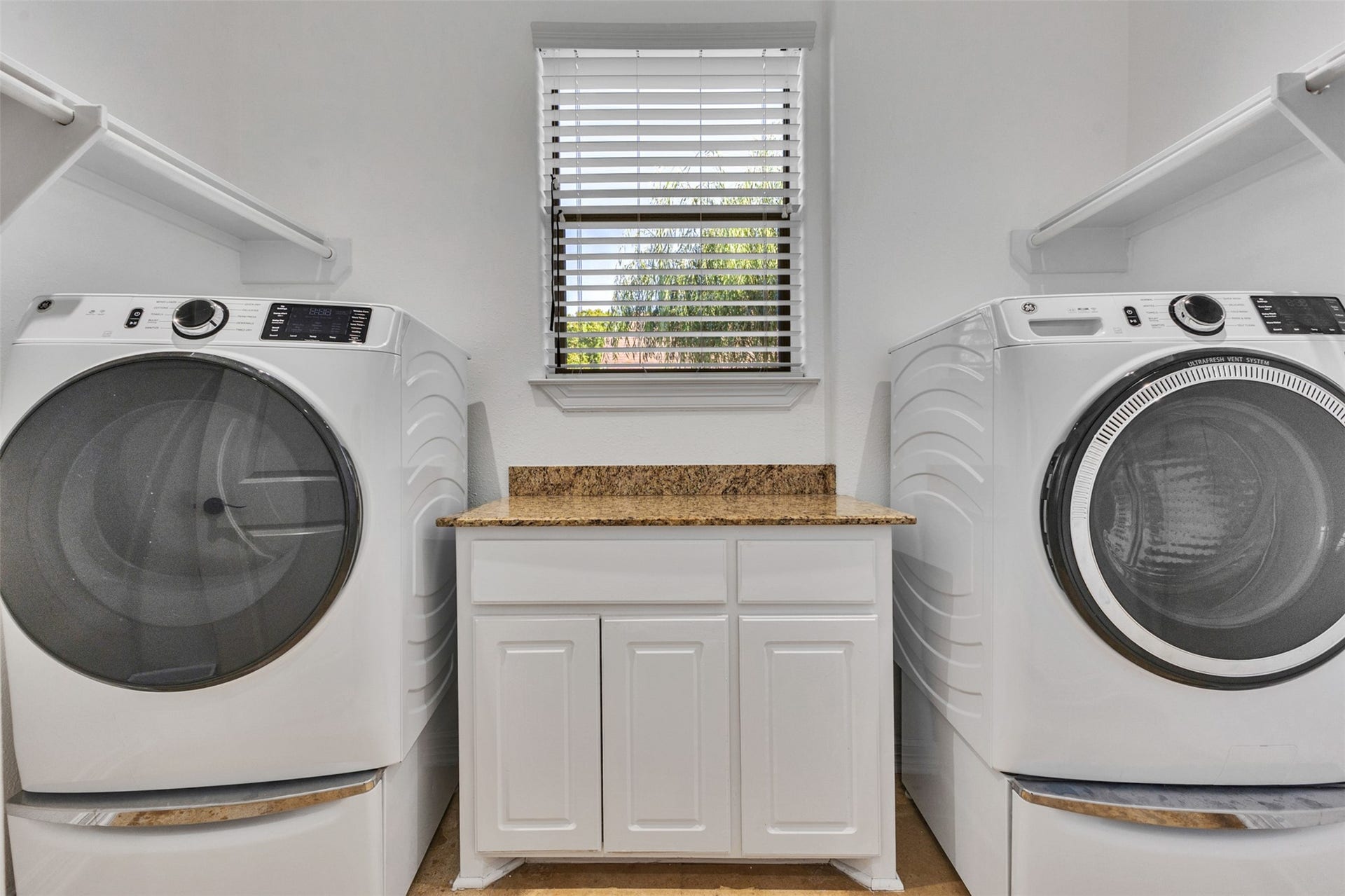 8606 Argentina Street, Houston, TX 77040 A dedicated laundry room provides a practical space to keep everyday chores organized and tucked away from the main living areas.
