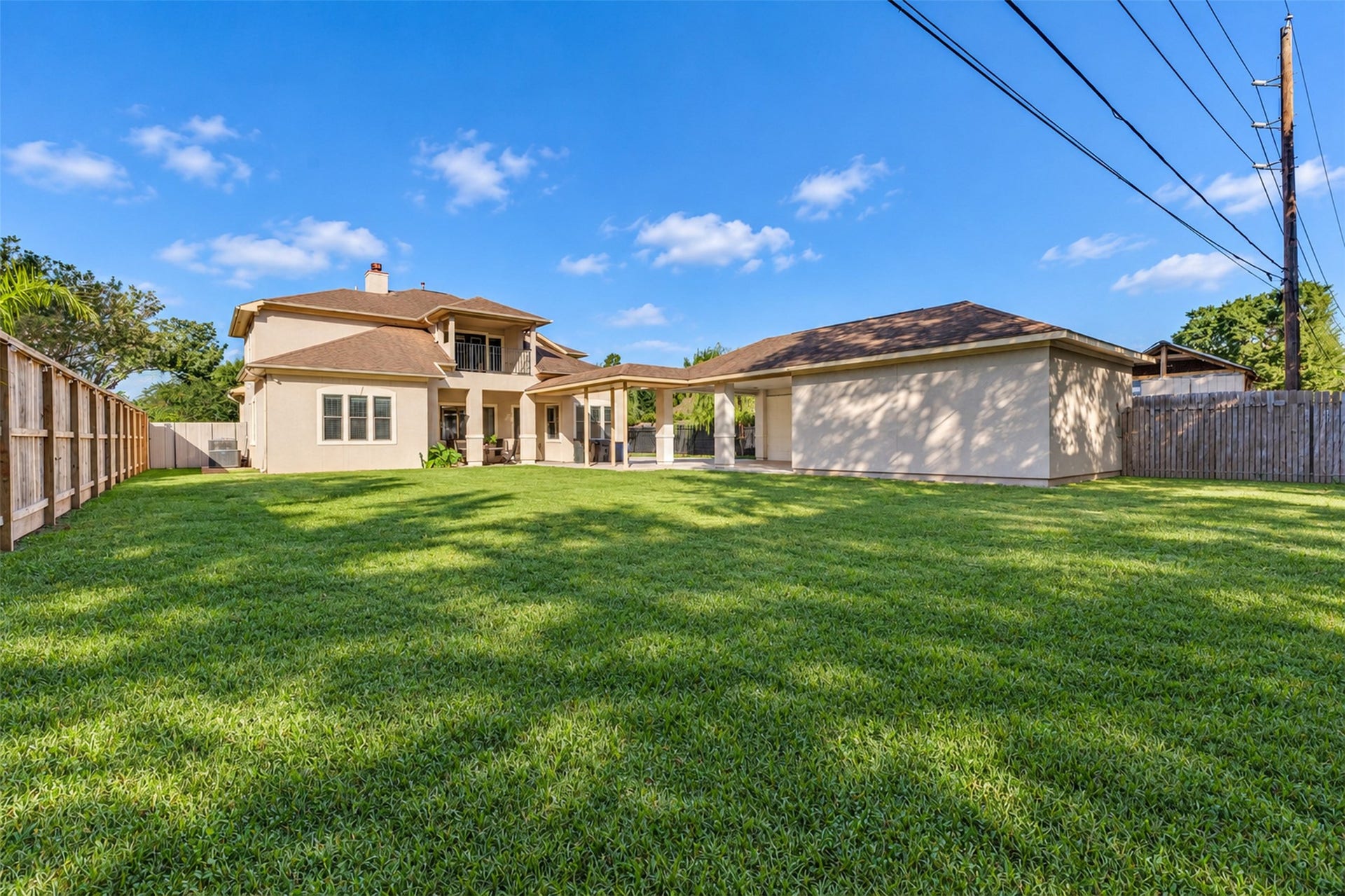 8606 Argentina Street, Houston, TX 77040 Backyard: A generously sized backyard offers space for outdoor seating, gardening, and entertaining.