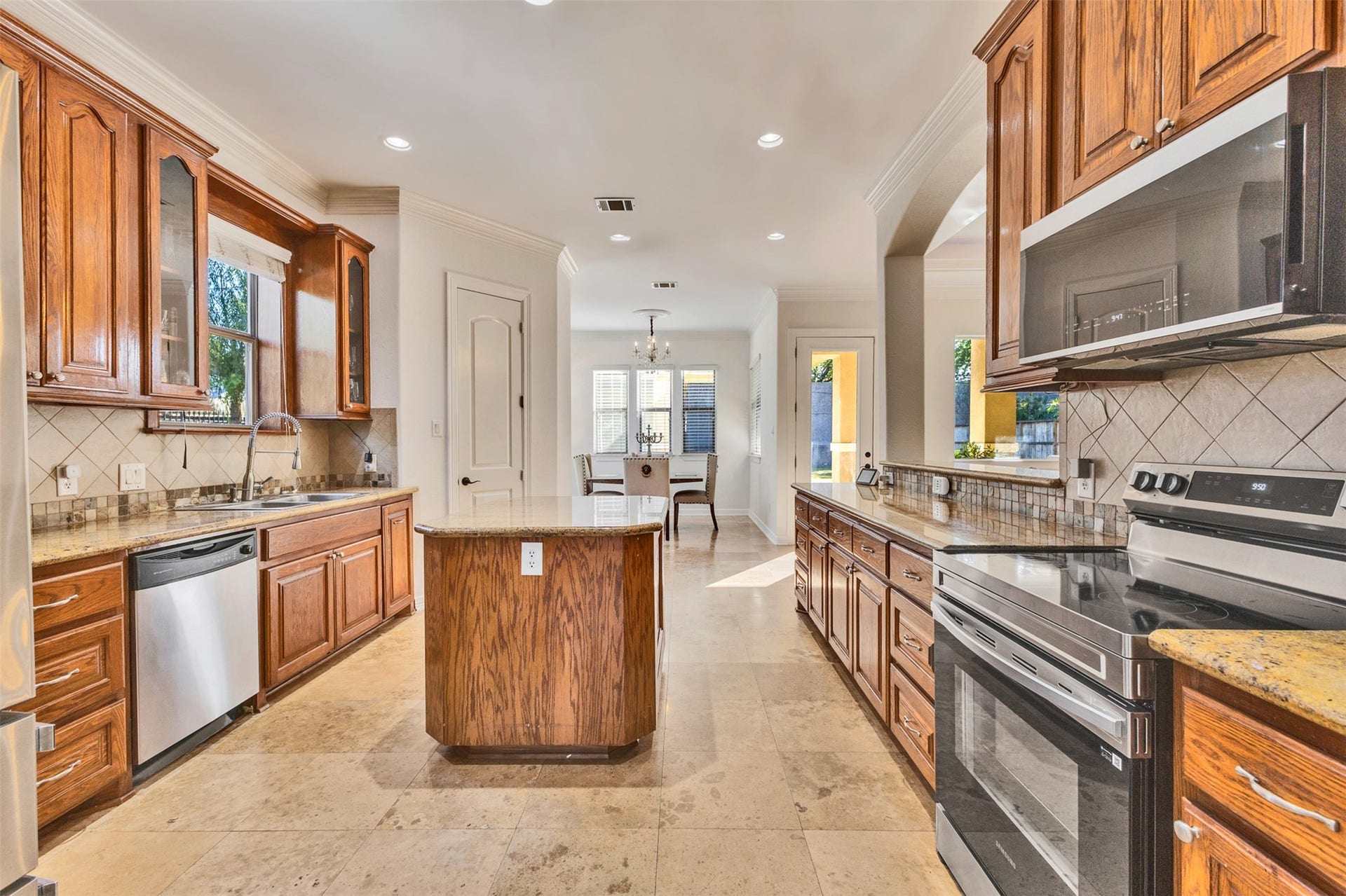 8606 Argentina Street, Houston, TX 77040 Kitchen: An inviting island kitchen opens to the living area, creating a connected space for everyday cooking and entertaining.