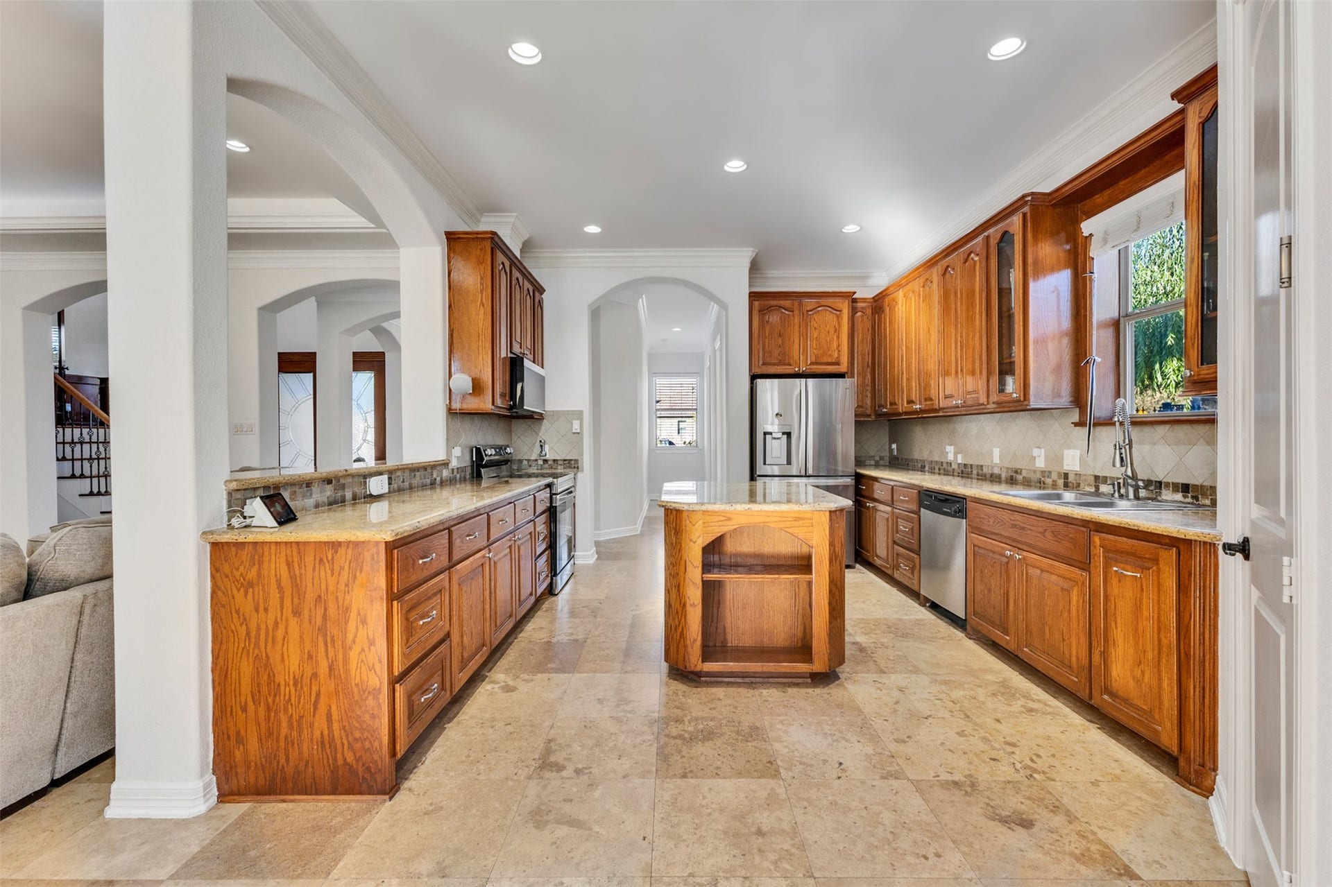 8606 Argentina Street, Houston, TX 77040 Kitchen: An inviting island kitchen opens to the living area, creating a connected space for everyday cooking and entertaining.