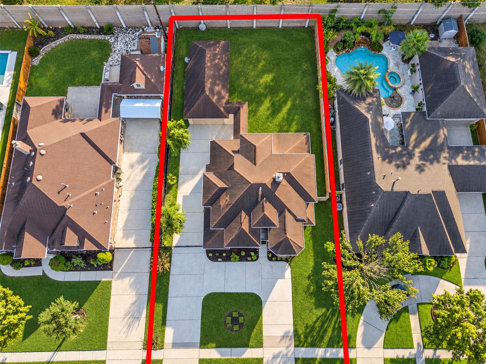 8606 Argentina Street, Houston, TX 77040 Aerial view showcasing the homes distinctive architecture, spacious lot, detached garage, and generous driveway parking.