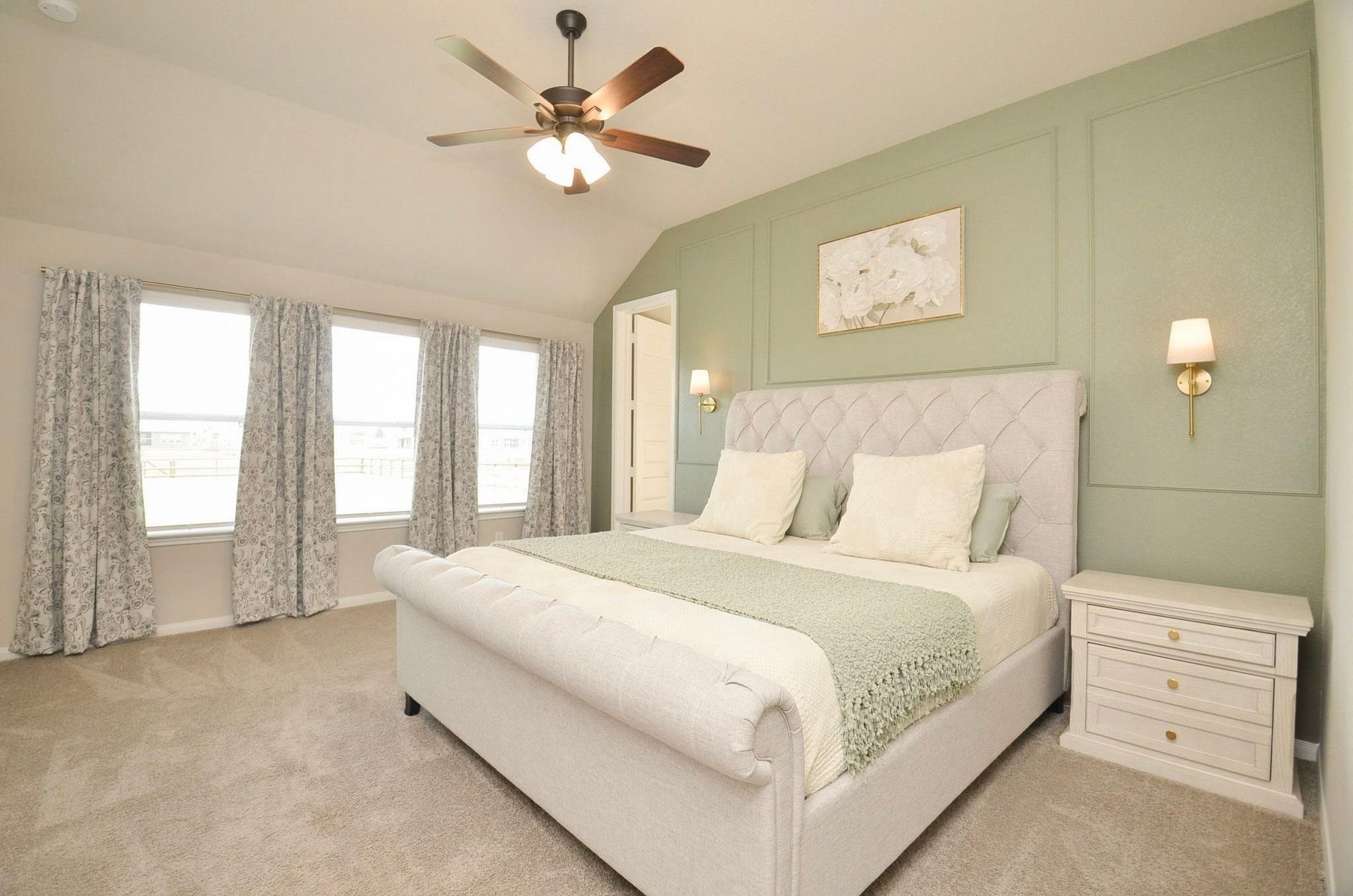 6803 Nichols Landing, Needville, TX 77461 Spacious primary bedroom with a wall of windows and gorgeous accent wall