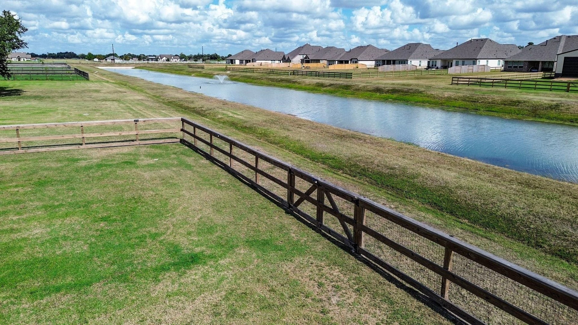 6803 Nichols Landing, Needville, TX 77461 Fully fenced back yard with gate to access the green space