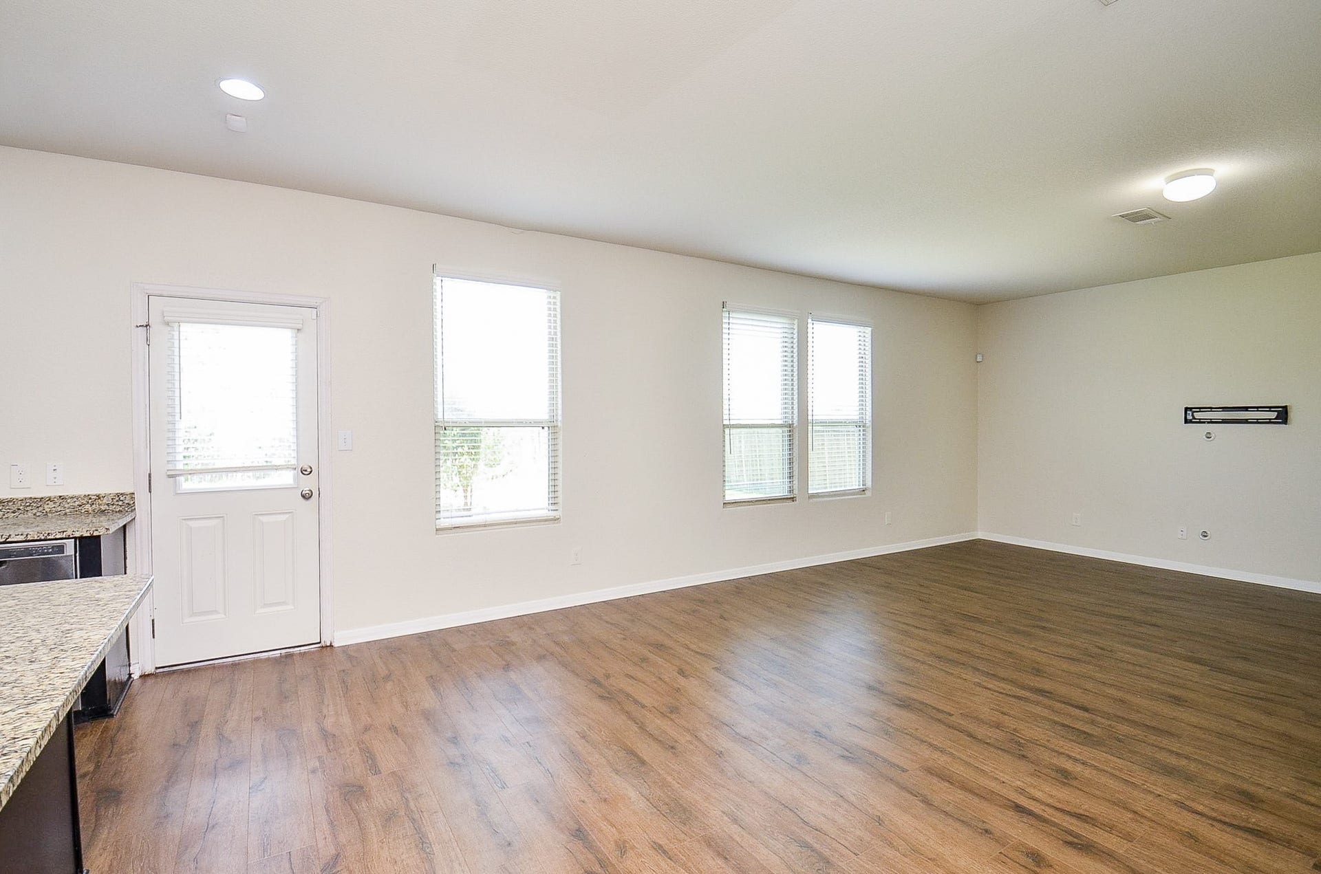 2539 Bedrock Lane, Missouri City, TX 77489 Spacious and bright living area with sleek floors, large windows, and an open layout perfect for entertaining.