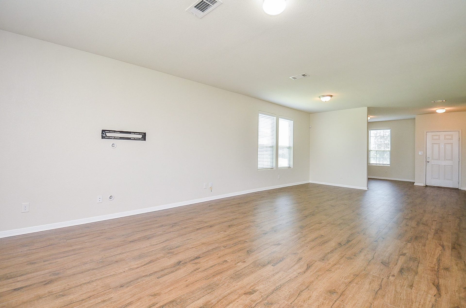 2539 Bedrock Lane, Missouri City, TX 77489 Spacious living area with elegant flooring, abundant natural light, and a versatile open layout, ready for personalization.