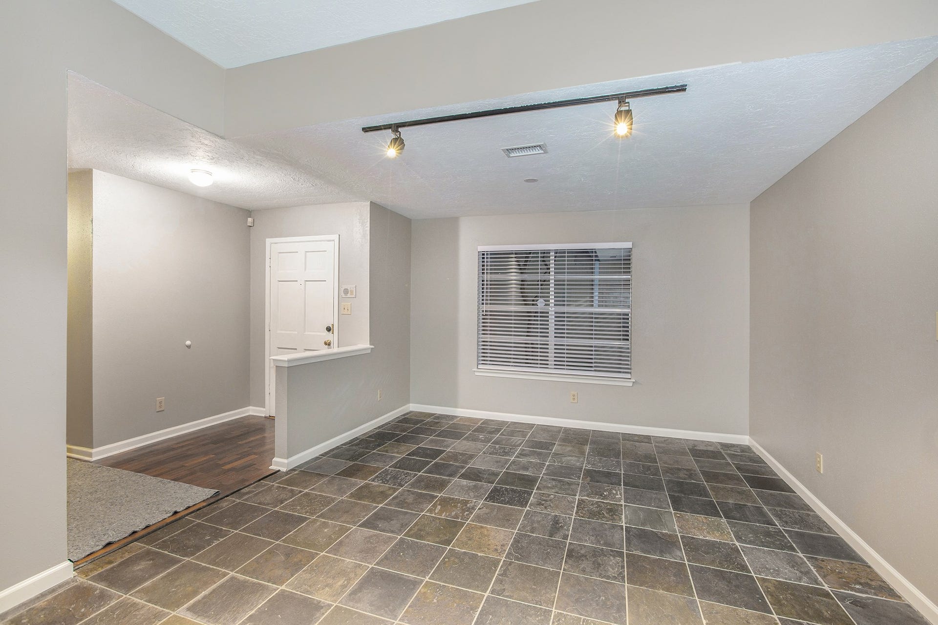 17002 Sky Blue Place, Houston, TX 77095 Dining room with track lighting and slate floor.