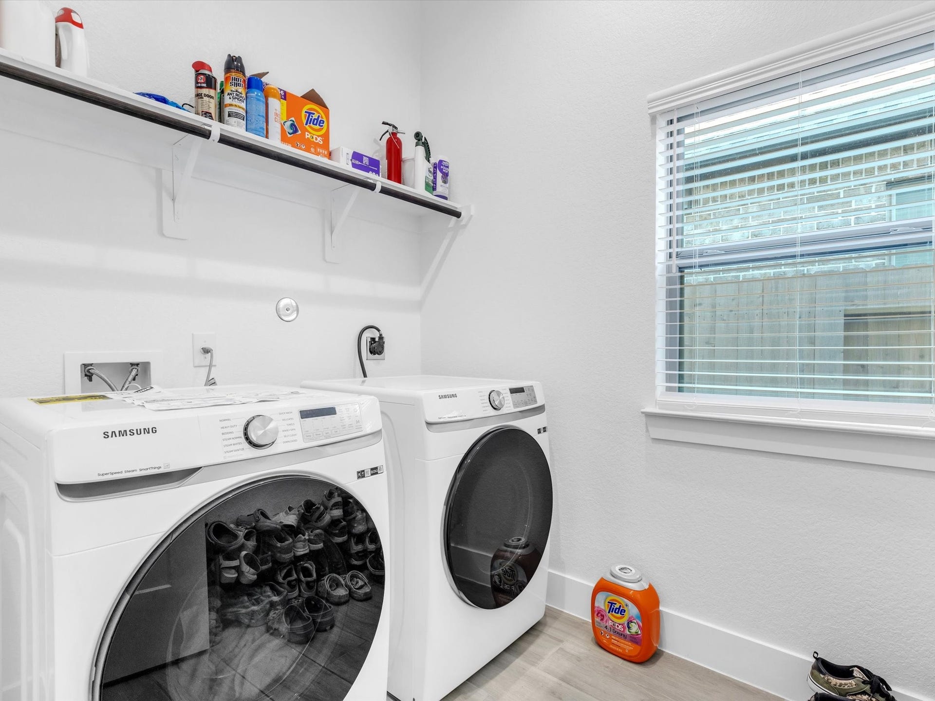 10718 Hidden Rock Drive, Missouri City, TX 77459 Convenient first-floor utility room offers plenty of space for full-size appliances, additional storage and natural light to make everyday chores a little easier.