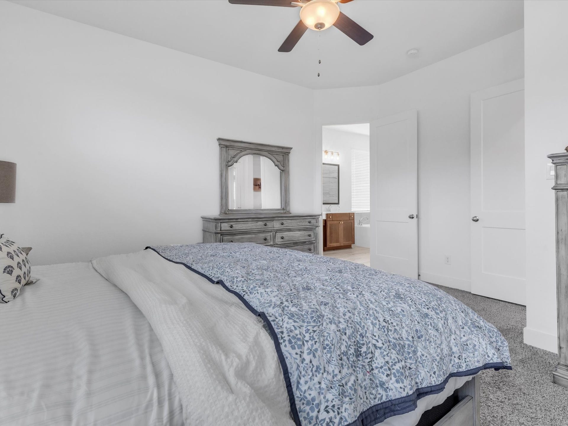 10718 Hidden Rock Drive, Missouri City, TX 77459 A second view of the primary suite highlights its generous proportions, ensuite bath access and comfortable separation from the homes main living areas.