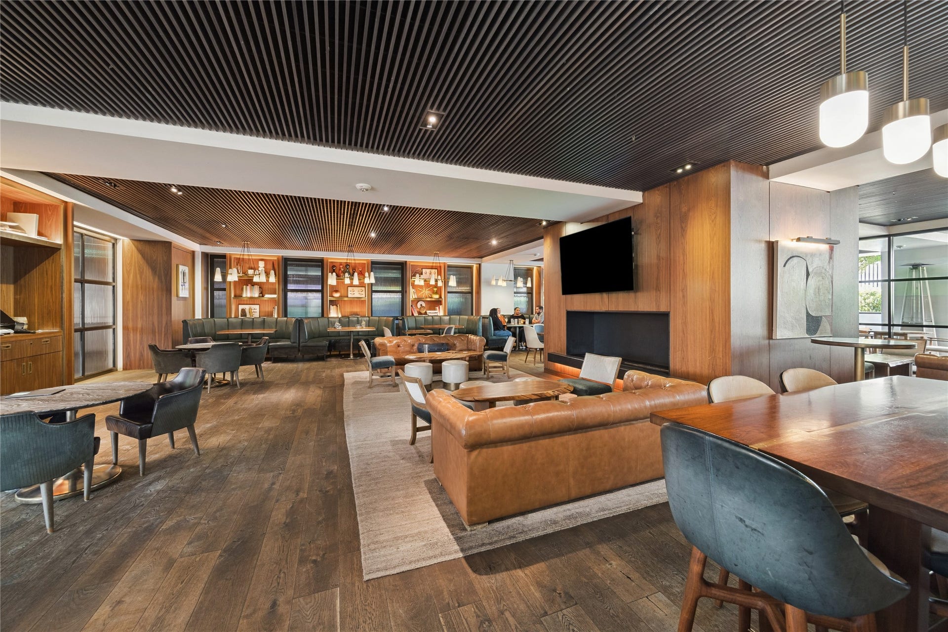 1111 Caroline Street, #2606, Houston, TX 77010 Tucked just beyond the main bar, this lounge offers a mix of booths, sofas, and private tables. The warm design and comfortable seating make it a perfect place to unwind with friends or enjoy a quiet evening close to home.