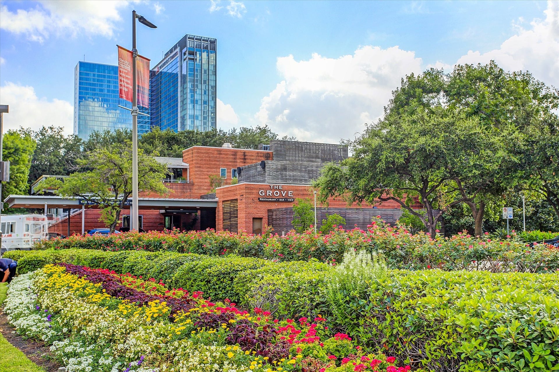 1111 Caroline Street, #2606, Houston, TX 77010 Discovery Green is a 12-acre urban park alive with art installations, playgrounds, water features, & year-round programming from concerts to outdoor movies. Colorful gardens, shaded lawns, & a lake for kayaking make it a true city retreat. Nestled within the park, The Grove offers floor-to-ceiling views of the greenery, a rooftop deck, and a menu built around fresh, seasonal ingredients. Together, the park and restaurant create a dynamic gathering place where nature, culture, dining, & recreation intersect.
