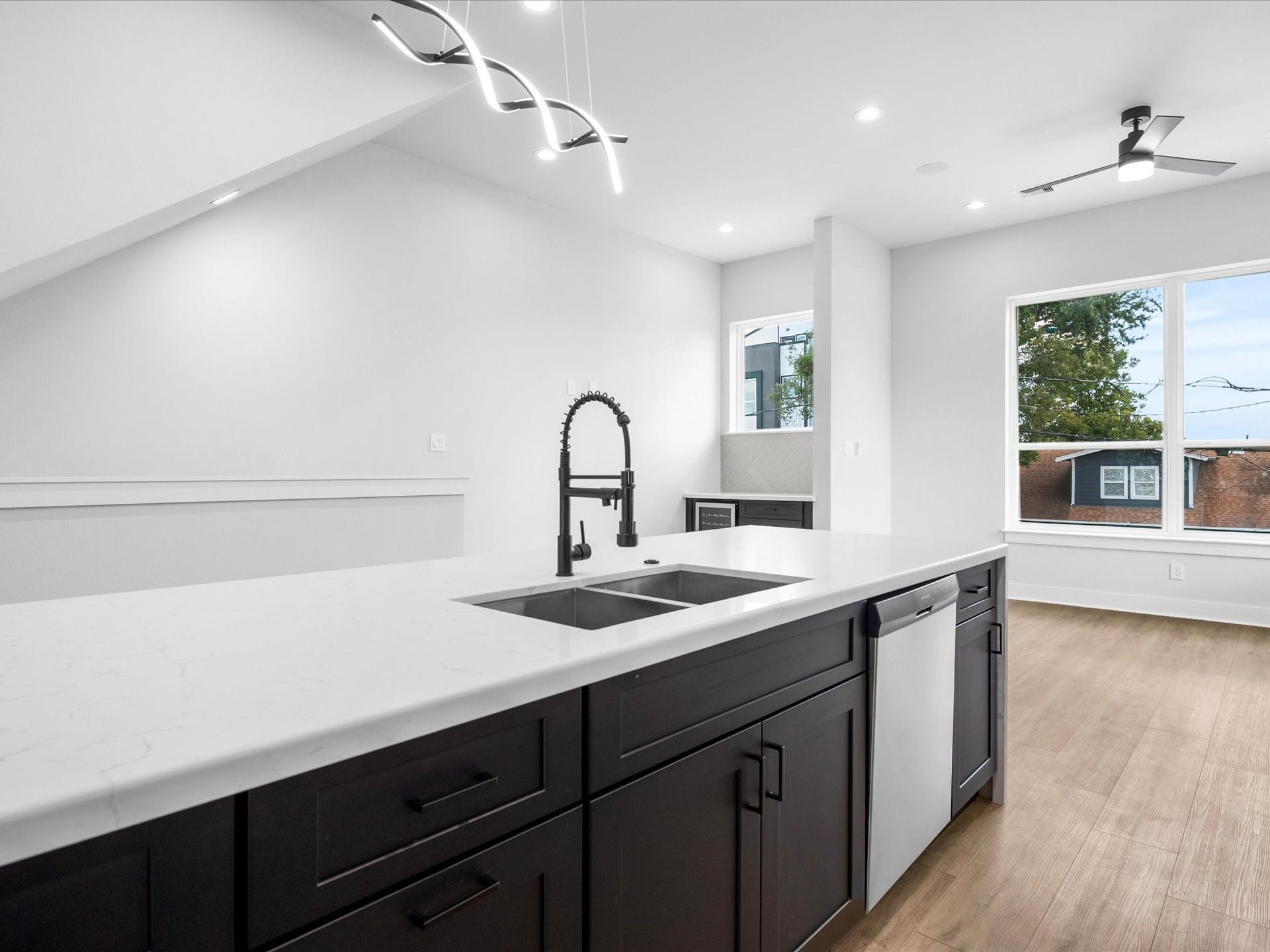 The impressive center island takes center stage, offering generous workspace and a striking focal point for the kitchen.