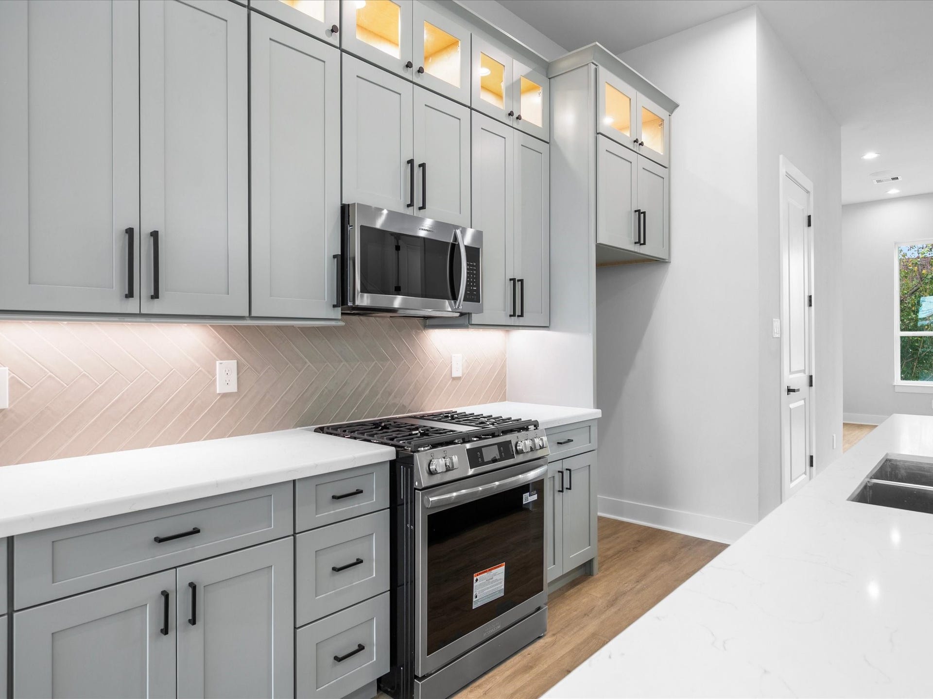 Thoughtfully selected finishes and contemporary details give the kitchen a polished look that complements the home's overall modern design.