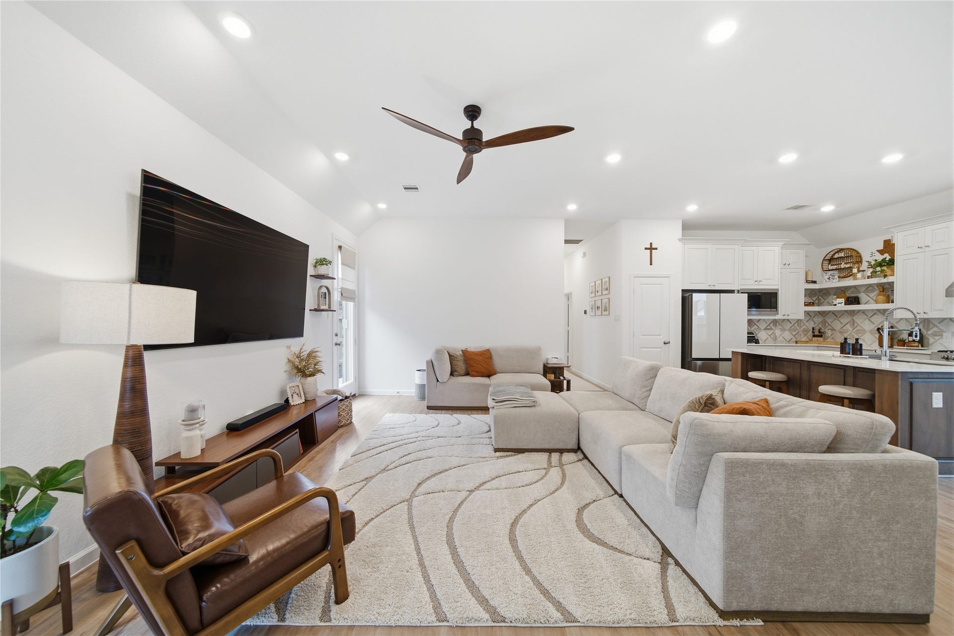 4919 Sand Clouds Drive, Katy, TX 77493 The home features mounted ceiling fans and LED lighting with smart features