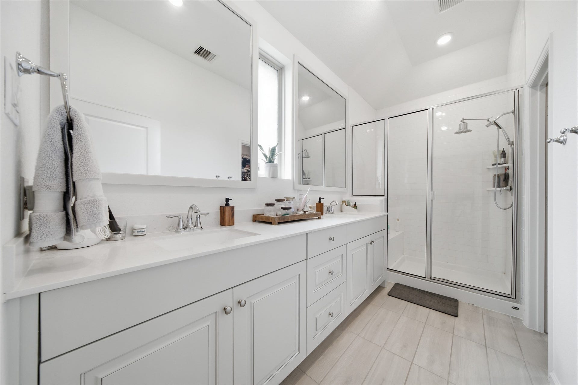 4919 Sand Clouds Drive, Katy, TX 77493 Primary Bathroom with an upgraded vanity, and a double shower. A window in the bathroom is always great for lighting as you are getting ready for the day!