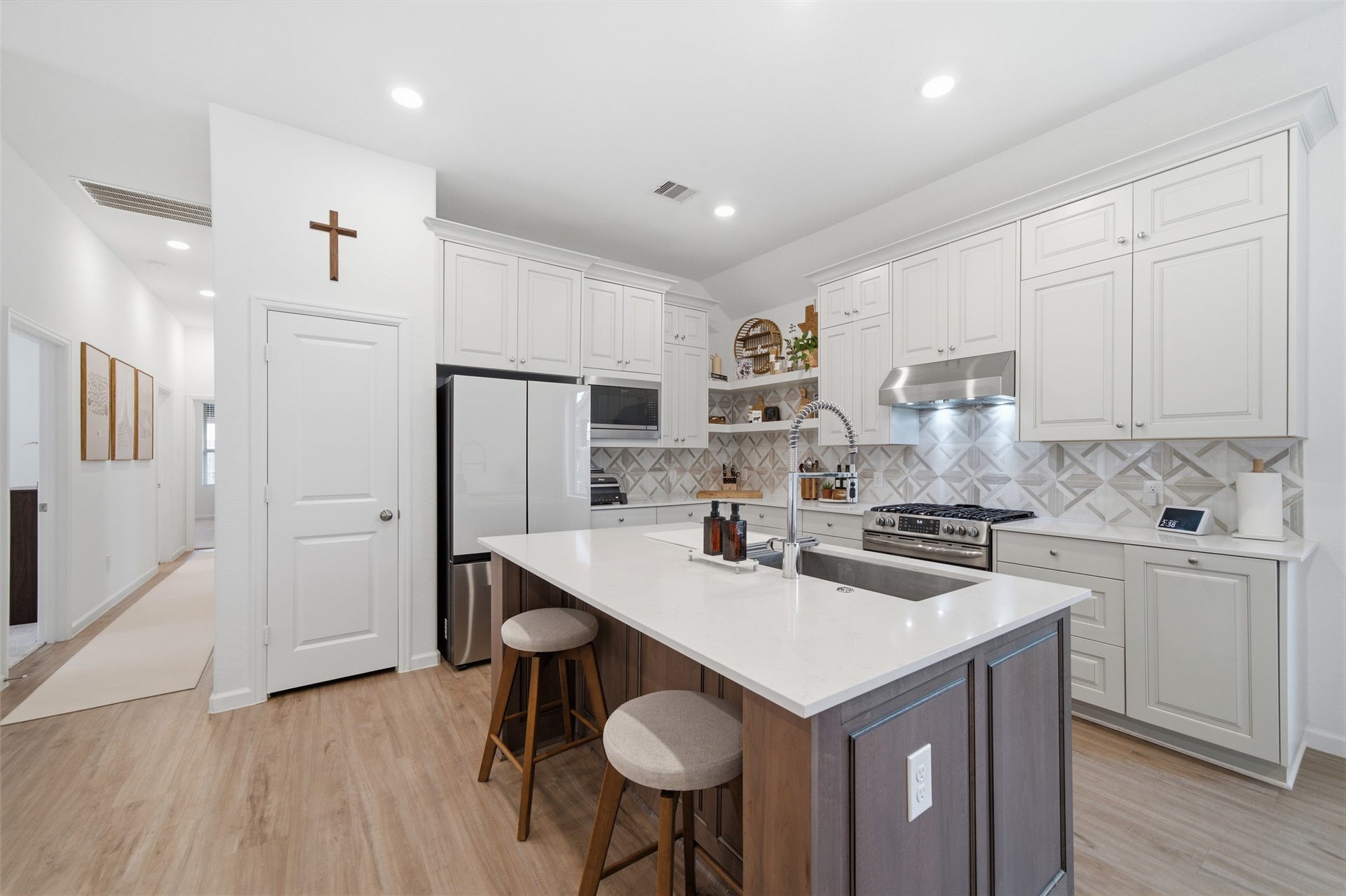 4919 Sand Clouds Drive, Katy, TX 77493 In addition to the pantry the kitchen features white cabinetry with pull outs added to make storage a breeze